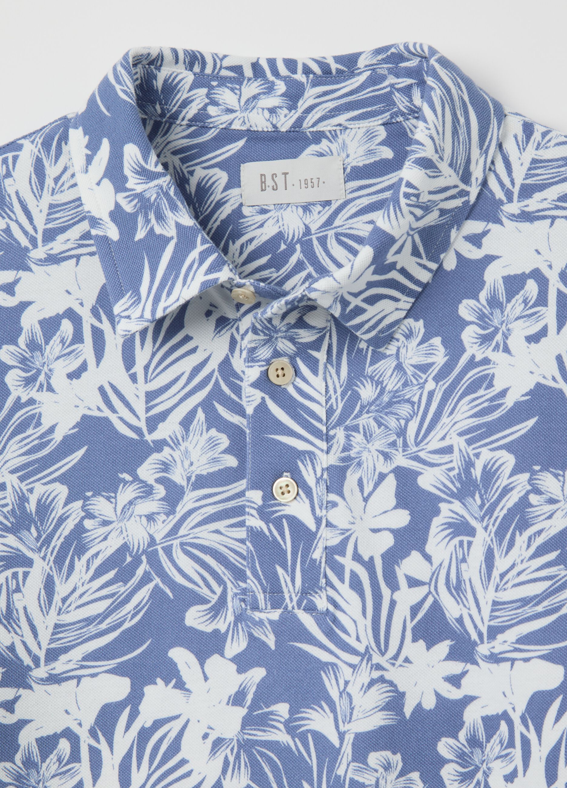BST blue polo shirt with short sleeves and floral print