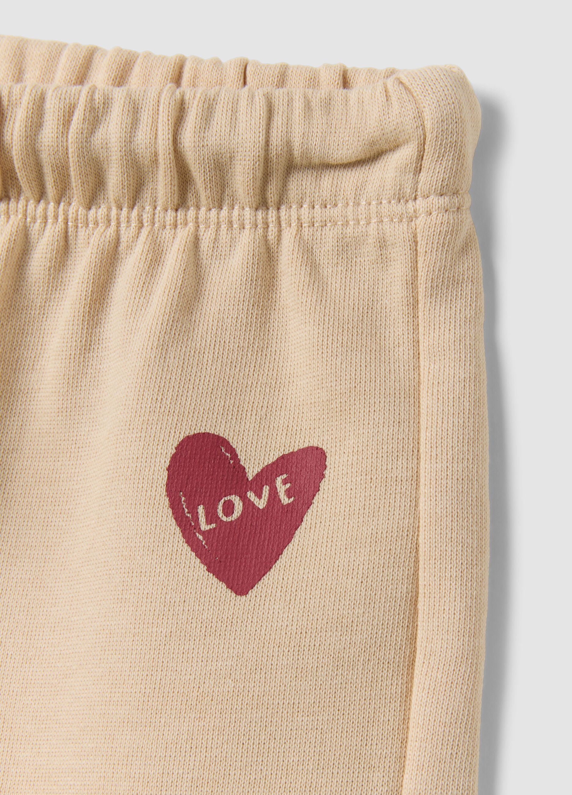 Pantaloni beige in puro cotone con vita elastica e stampa per bimba