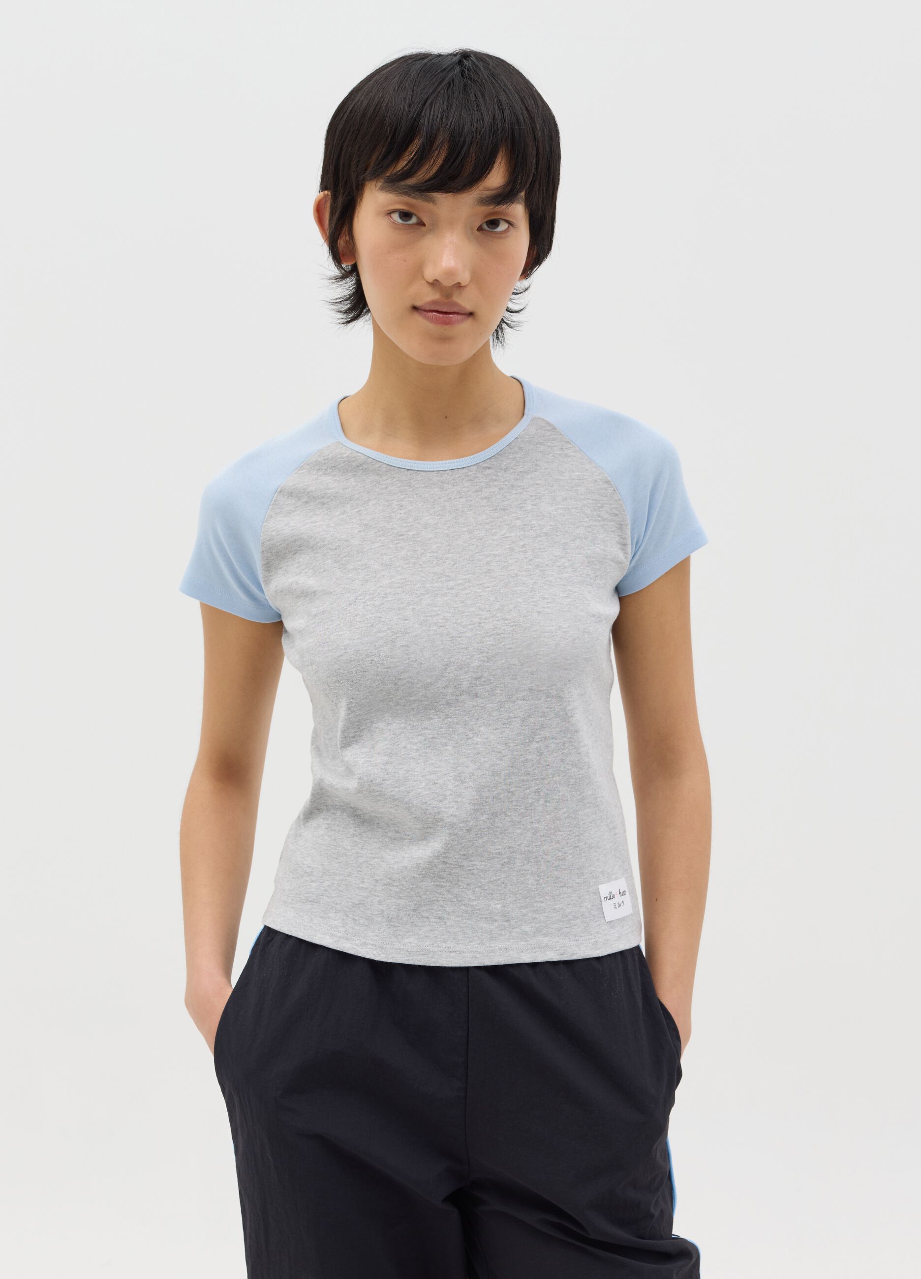 Grey T-shirt with light blue raglan sleeves