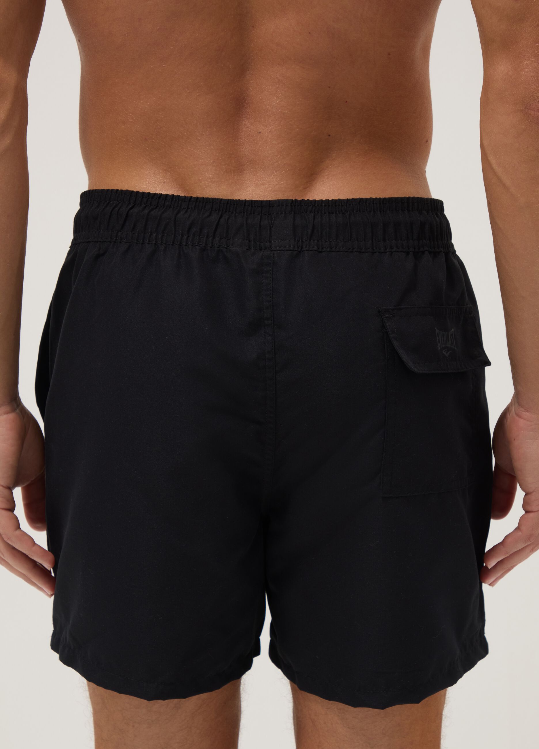 Black swim shorts with drawstring waist
