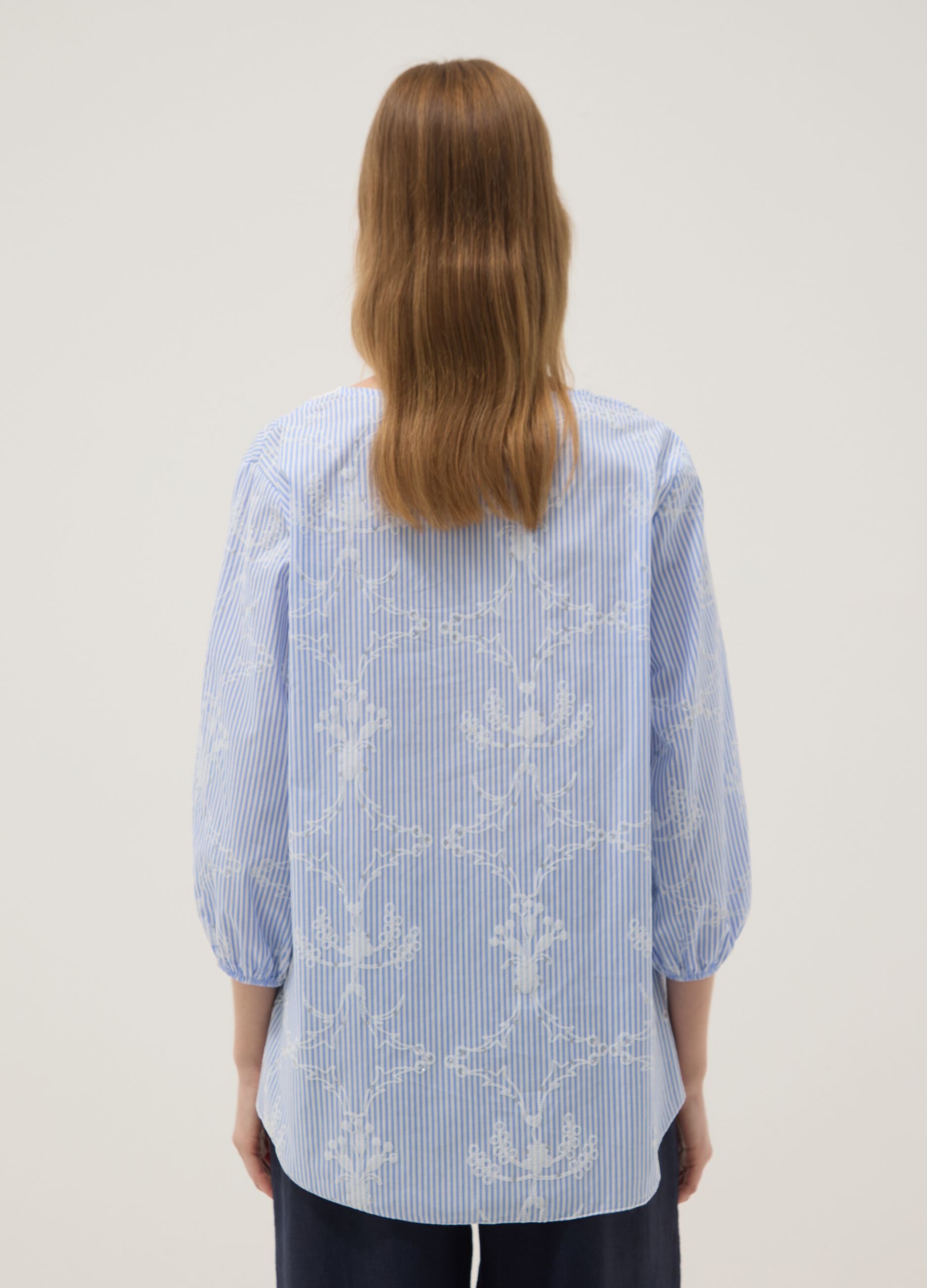 Blue cotton-blend top with embroidery and V-neck