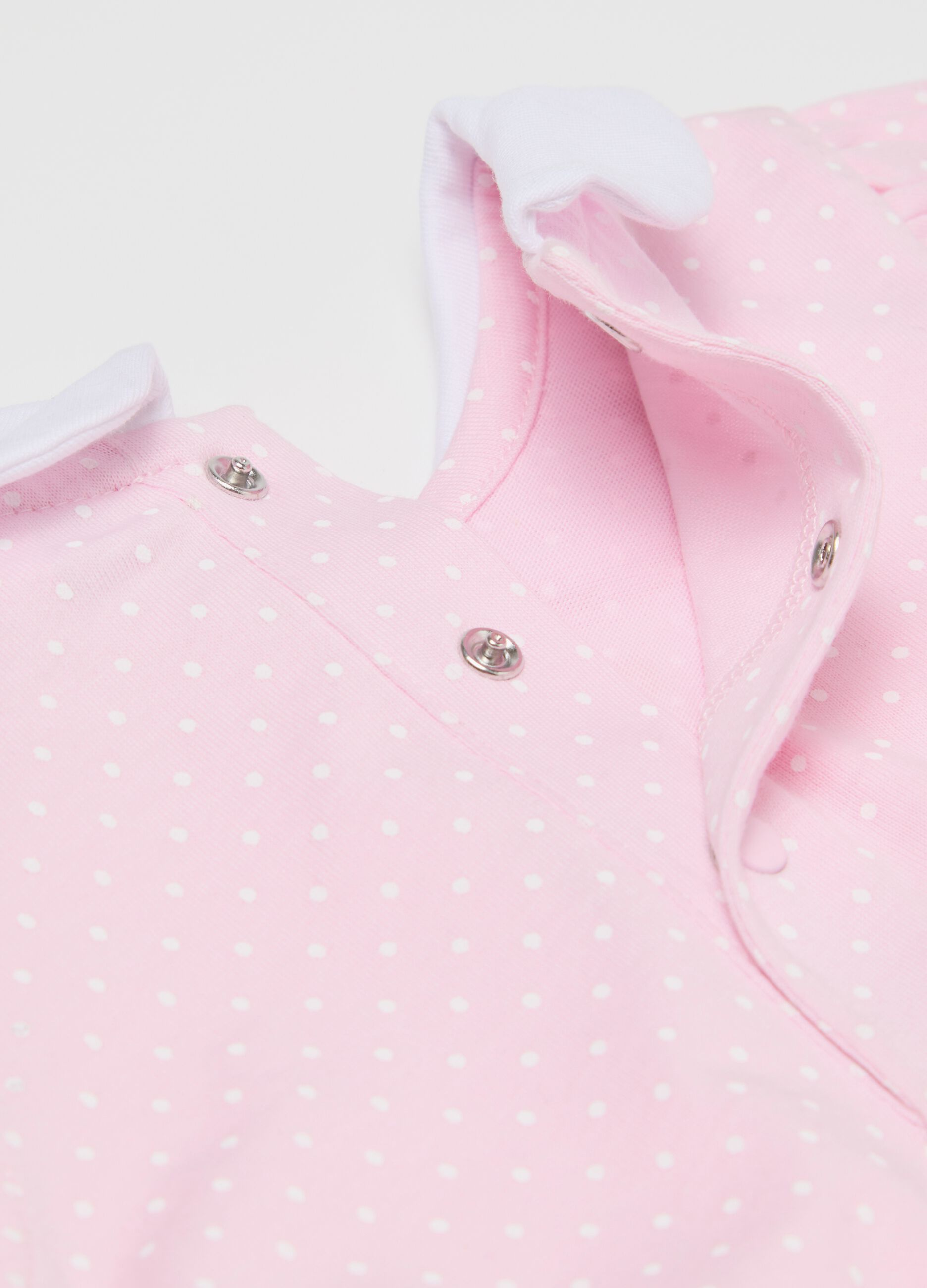 Pink romper suit in organic cotton with micro polka dot pattern