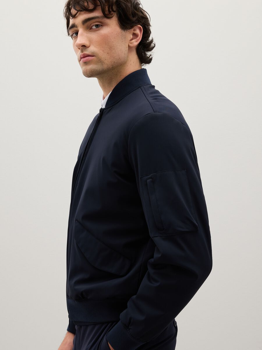 Stretch blue bomber with zip closure_2