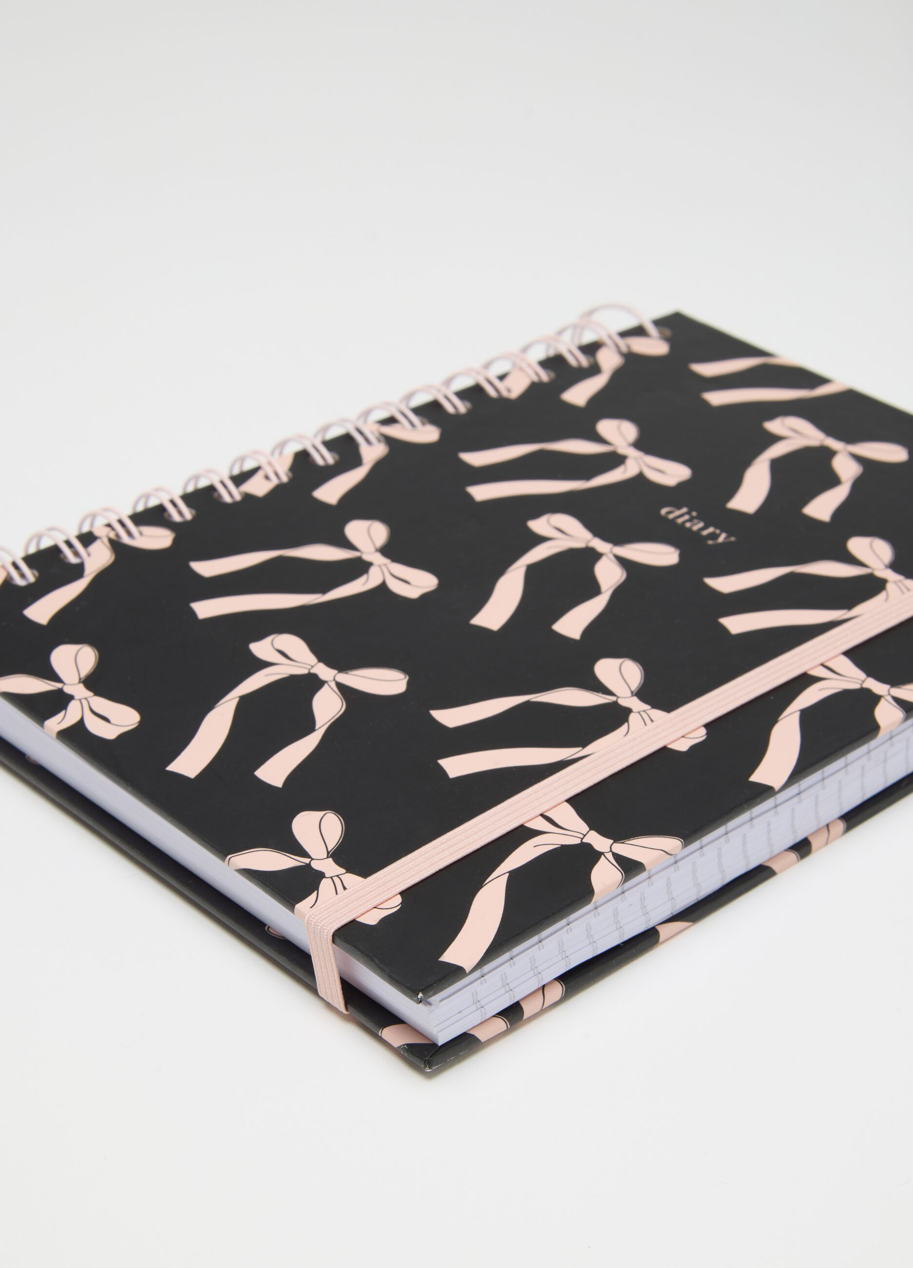 Quaderno in carta multicolor con fiocchi