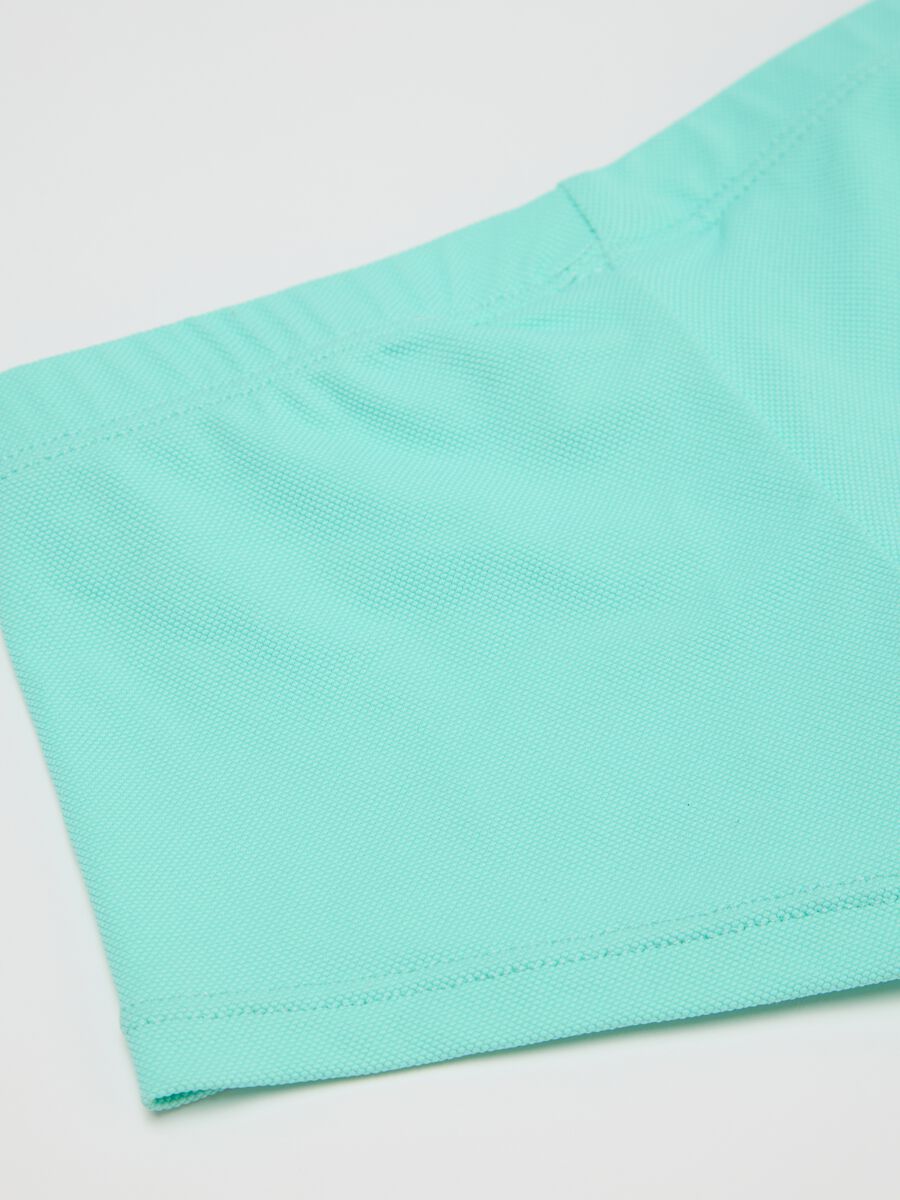 Boys’ swimsuit in light blue stretch fabric with print_3