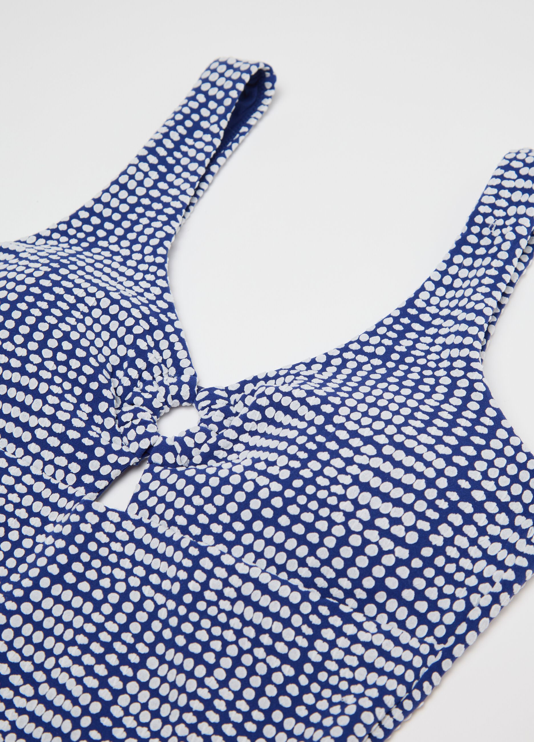 Blue one-piece swimsuit with geometric pattern
