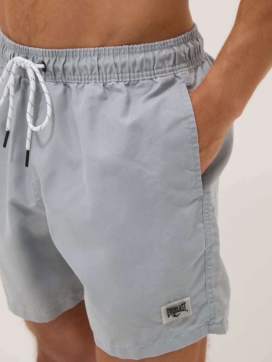 Blue swim shorts with drawstring waist_3