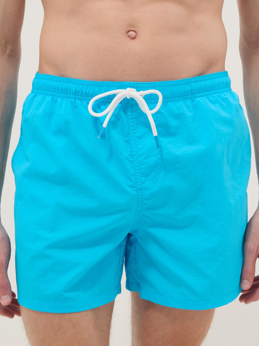 Blue swim shorts with elasticated waist_1