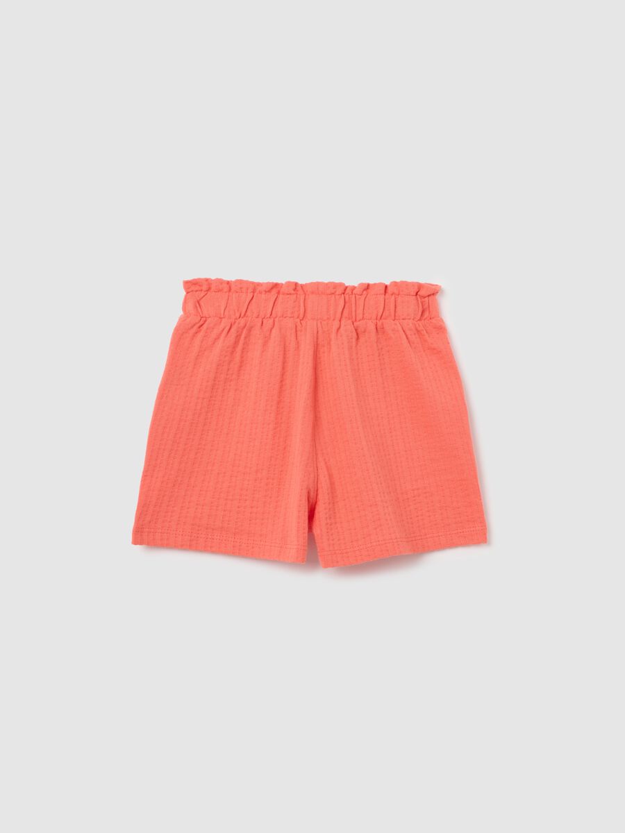 Girls’ shorts in 100% orange cotton with regular fit_1