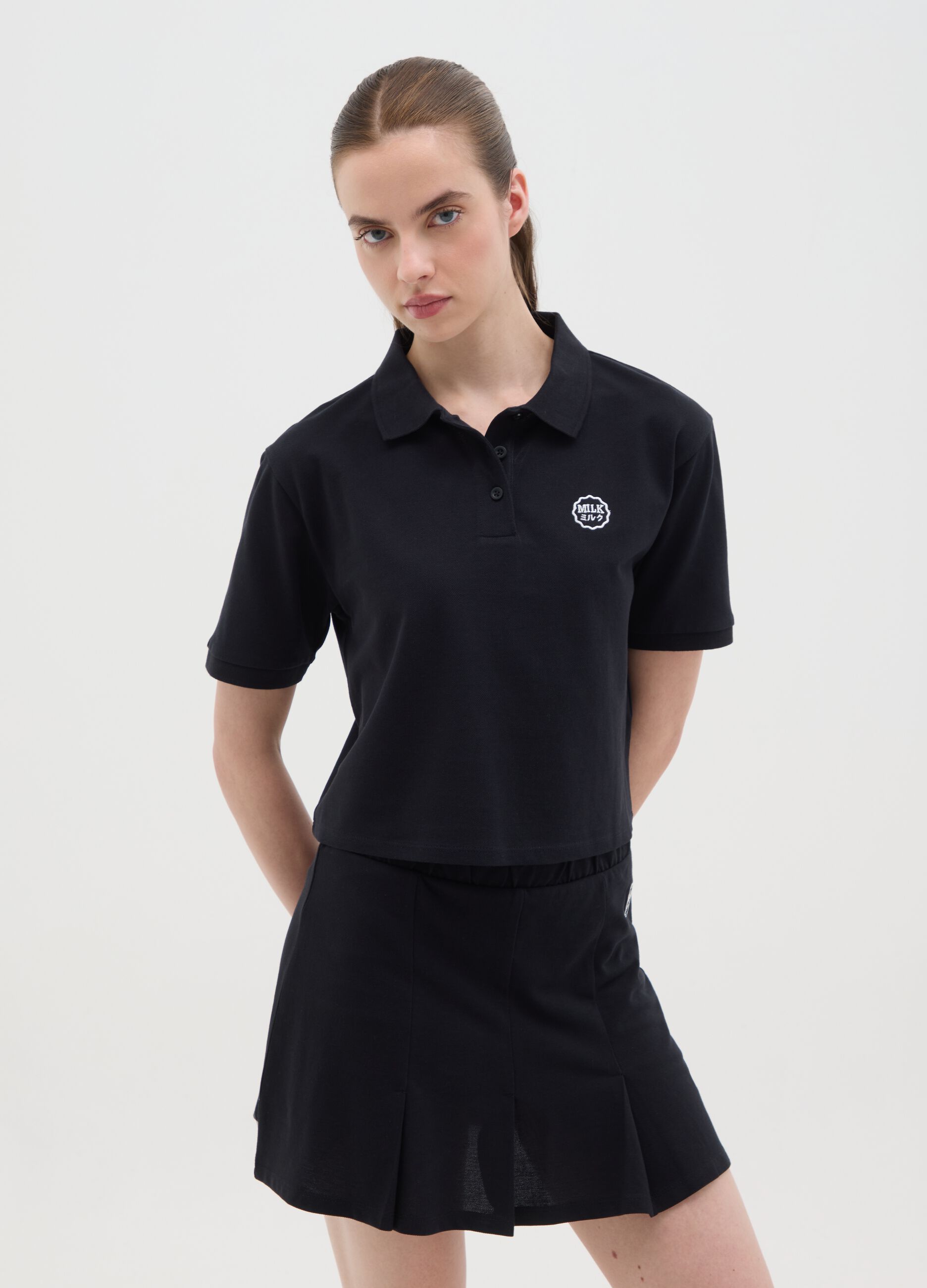 Women's black pure cotton regular fit polo with classic collar and embroidered logo