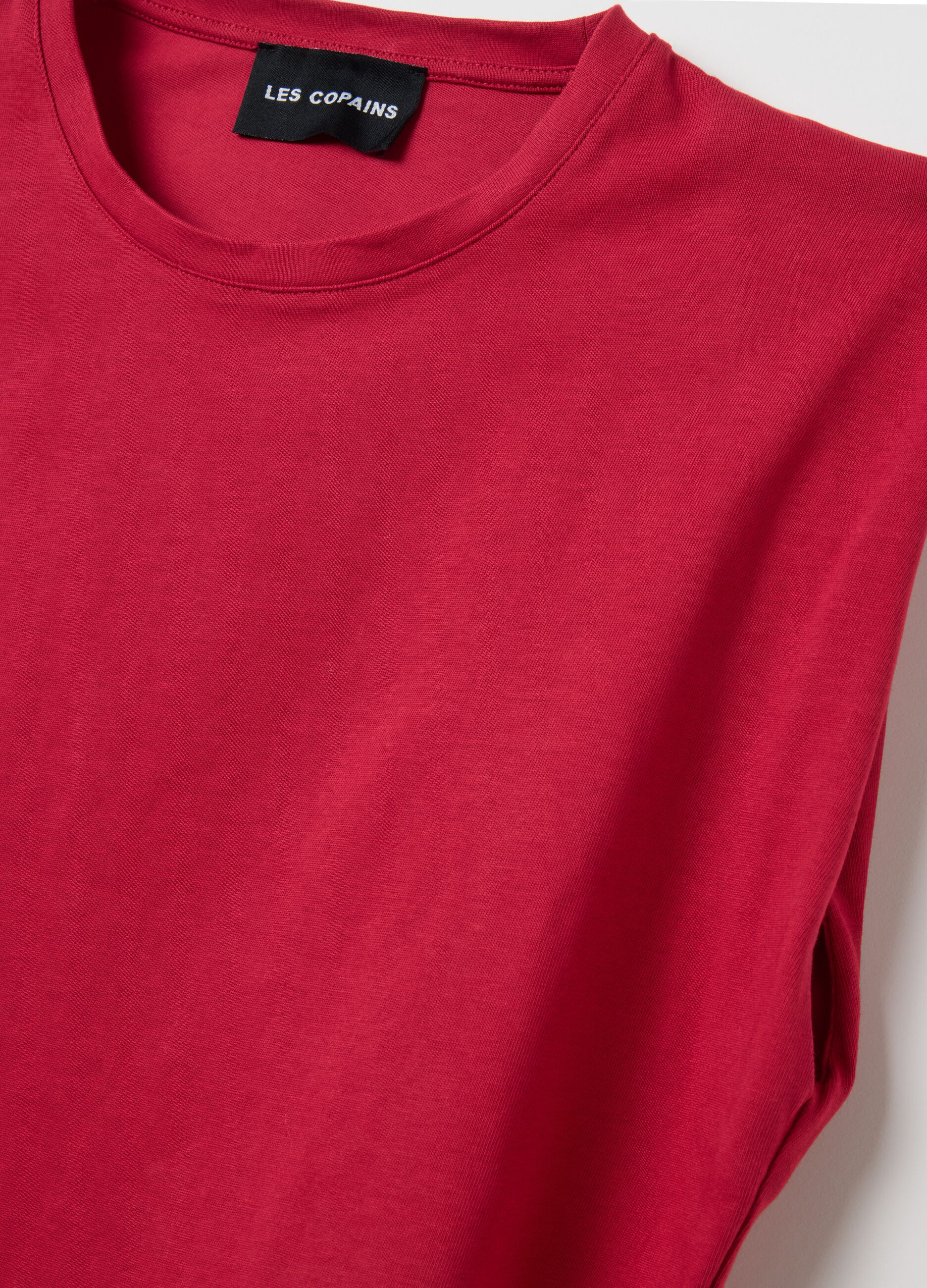 Red sleeveless boxy-fit T-shirt with spaghetti straps