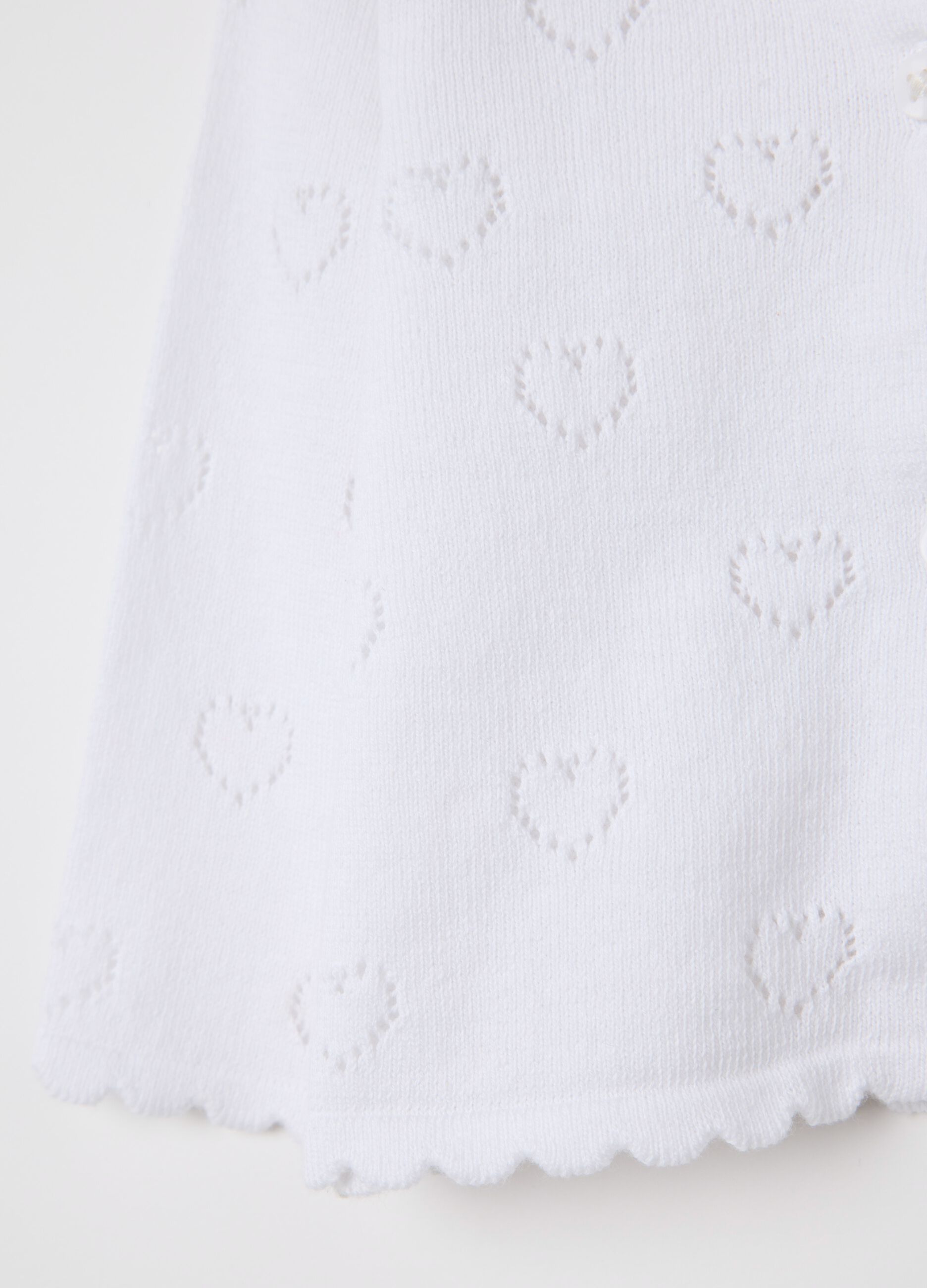 White cardigan with openwork hearts motif
