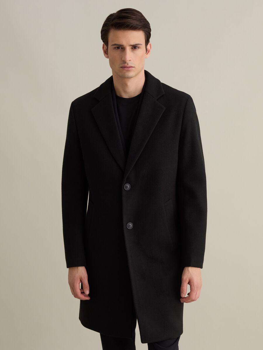 Long single-breasted solid colour coat_0