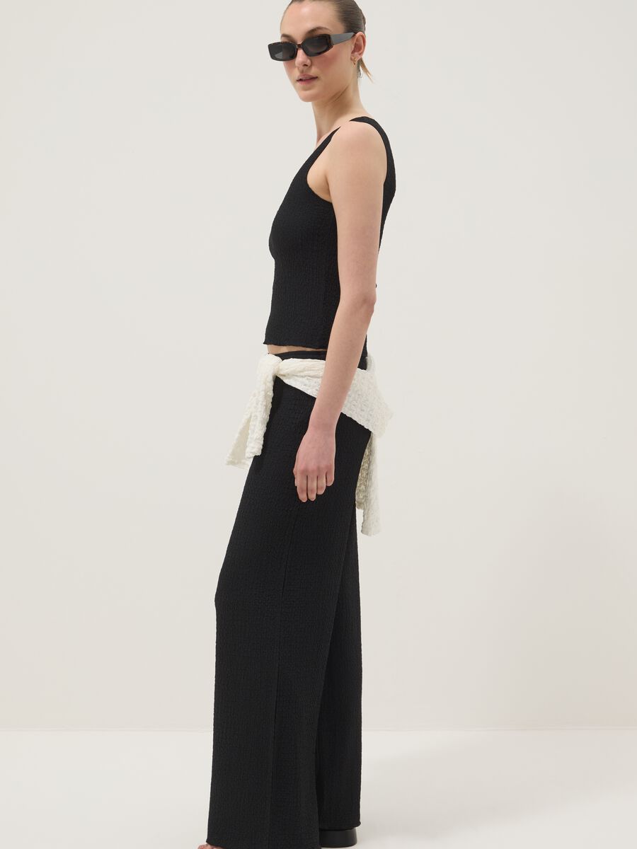 Black stretchy wide-leg trousers with crinkled texture_1