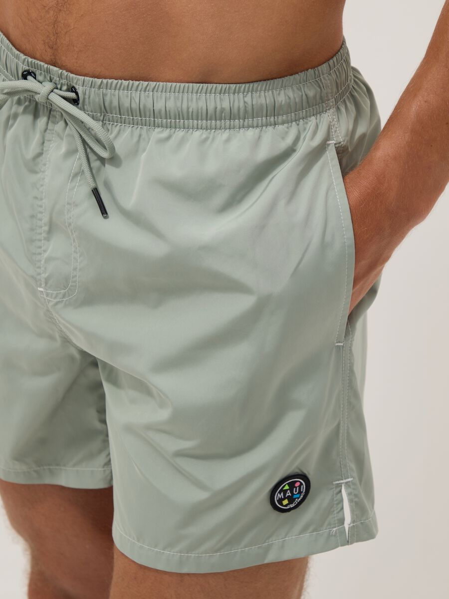 Green swim shorts with elasticated waistband and drawstring_4