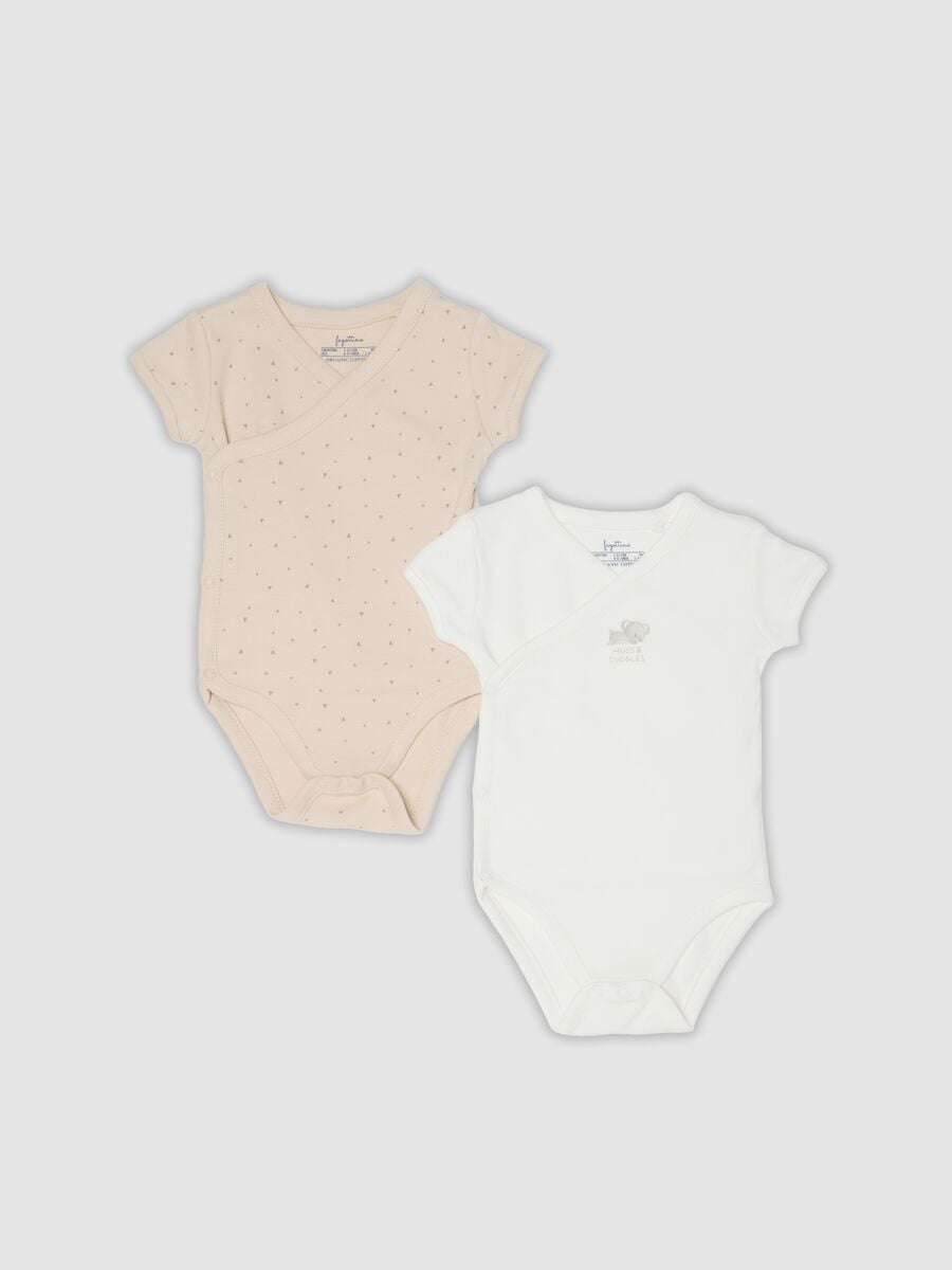 Bipack di body beige e bianco in cotone organico a maniche corte per bimbo_0