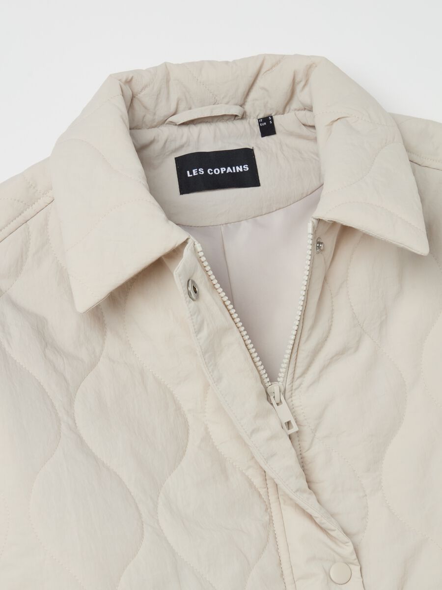 Short quilted jacket with buttons_5