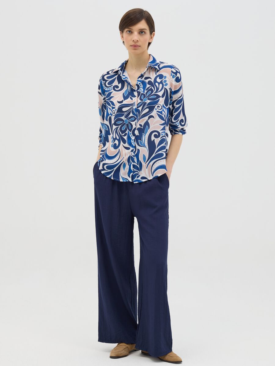 Blue and beige shirt with floral pattern_1