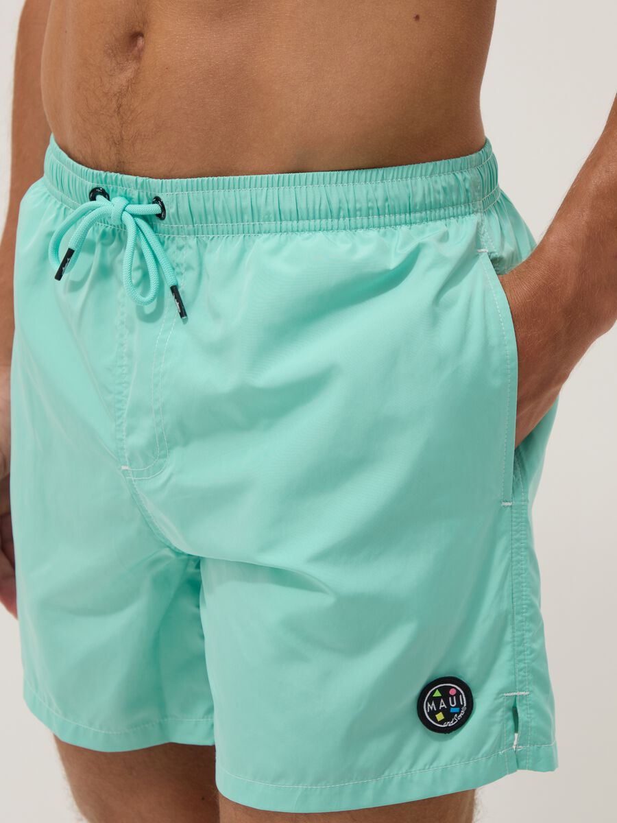 Light blue swim shorts with drawstring waist_3