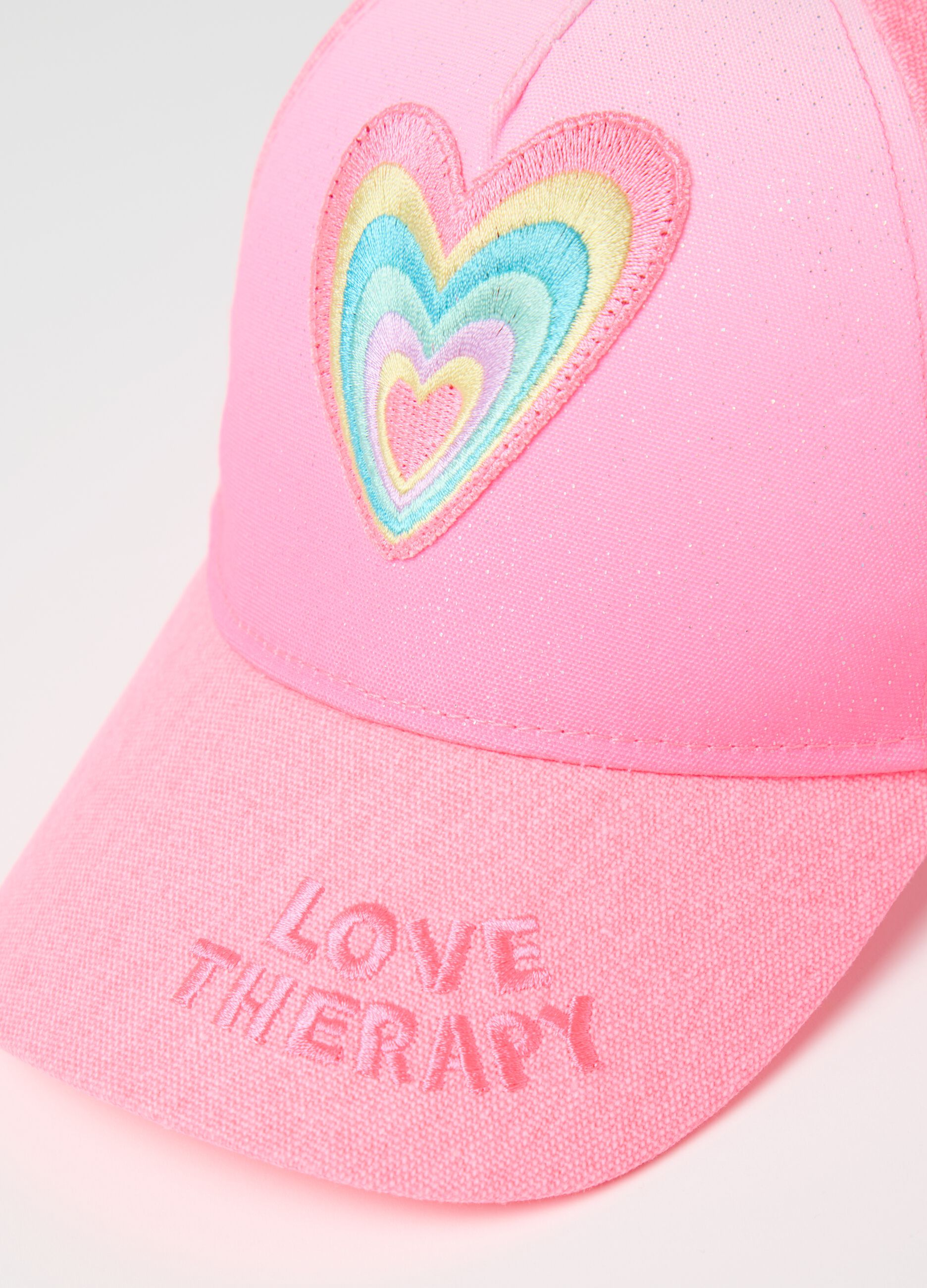 Pink cap with multicoloured heart