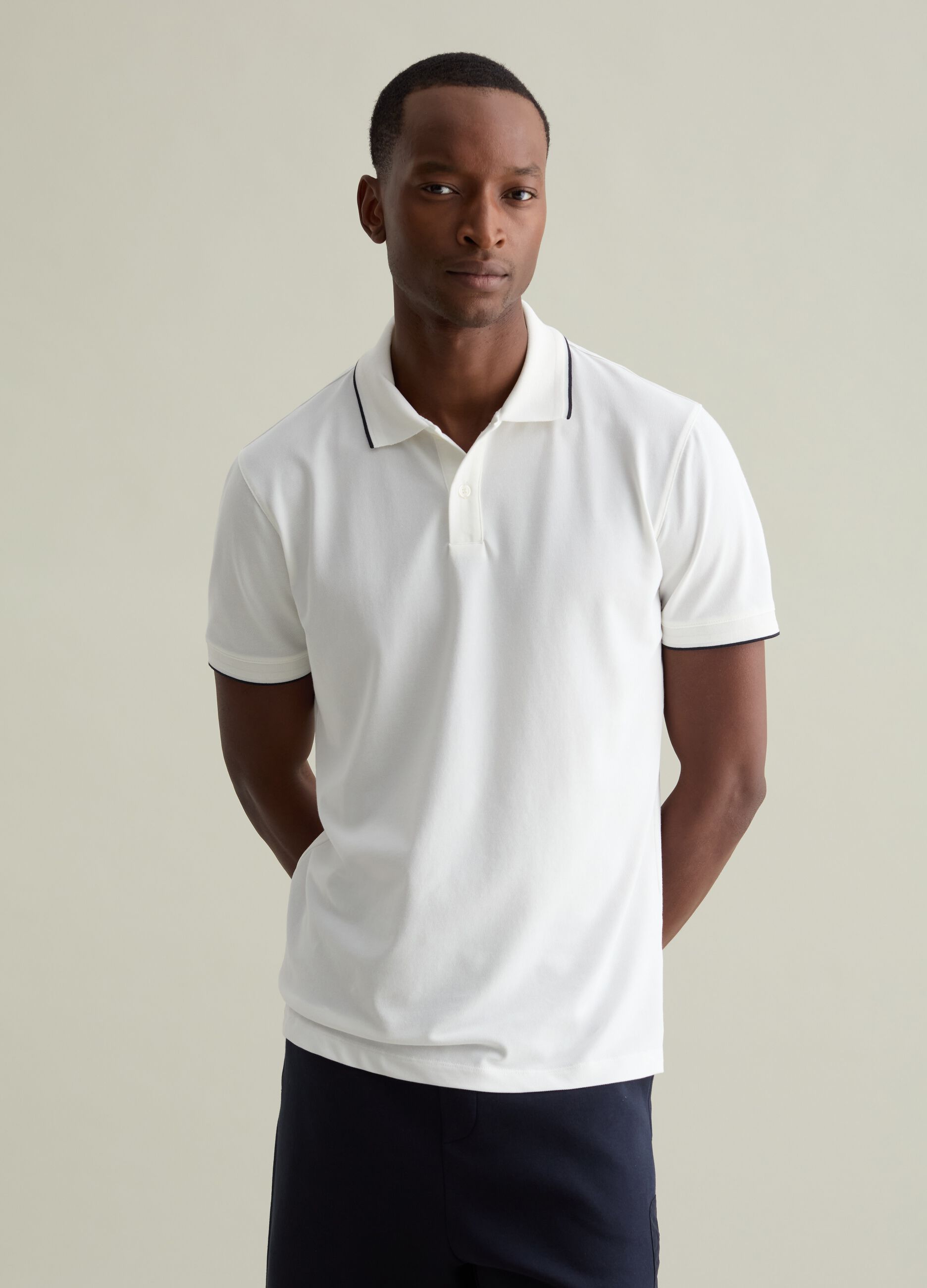 Polo shirt in technical fabric with contrasting edging