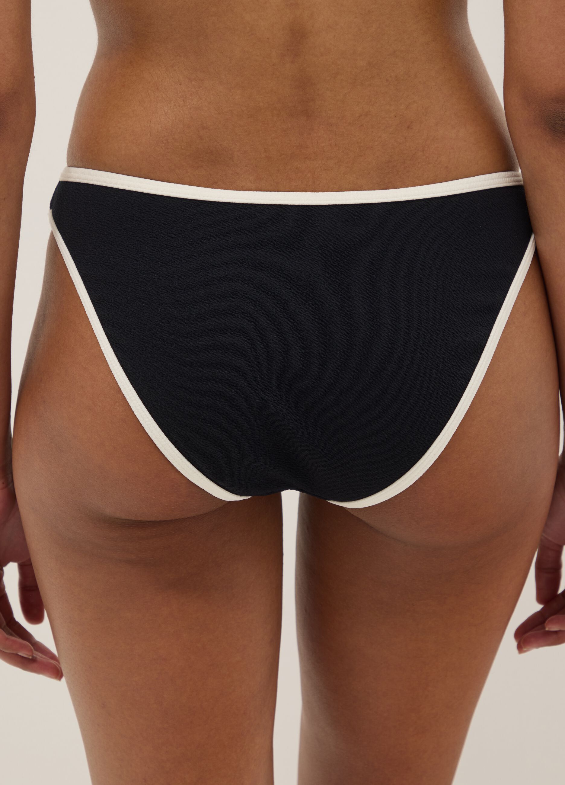 Black stretch swim briefs with white trim