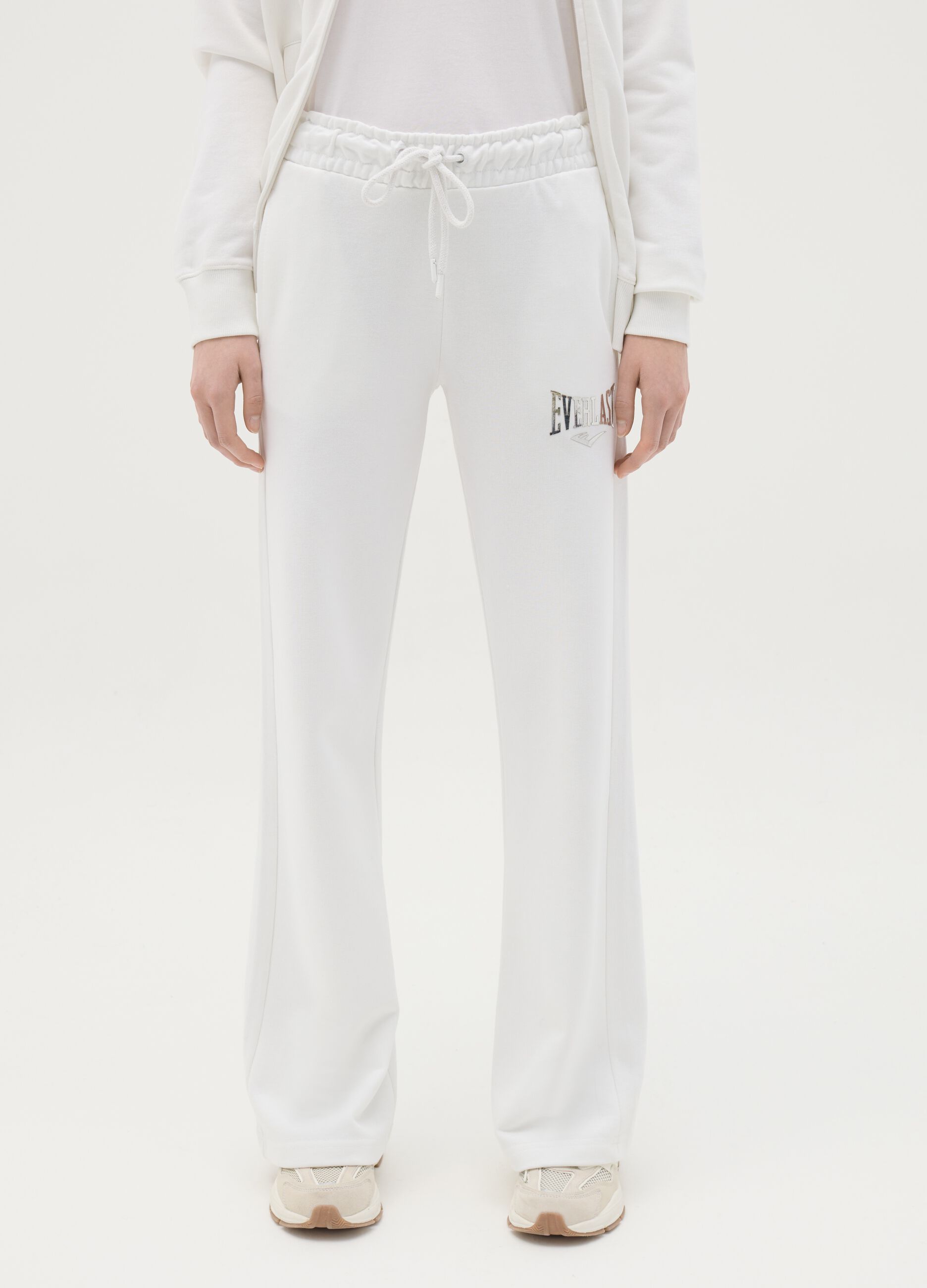White flare joggers with drawstring and logo print