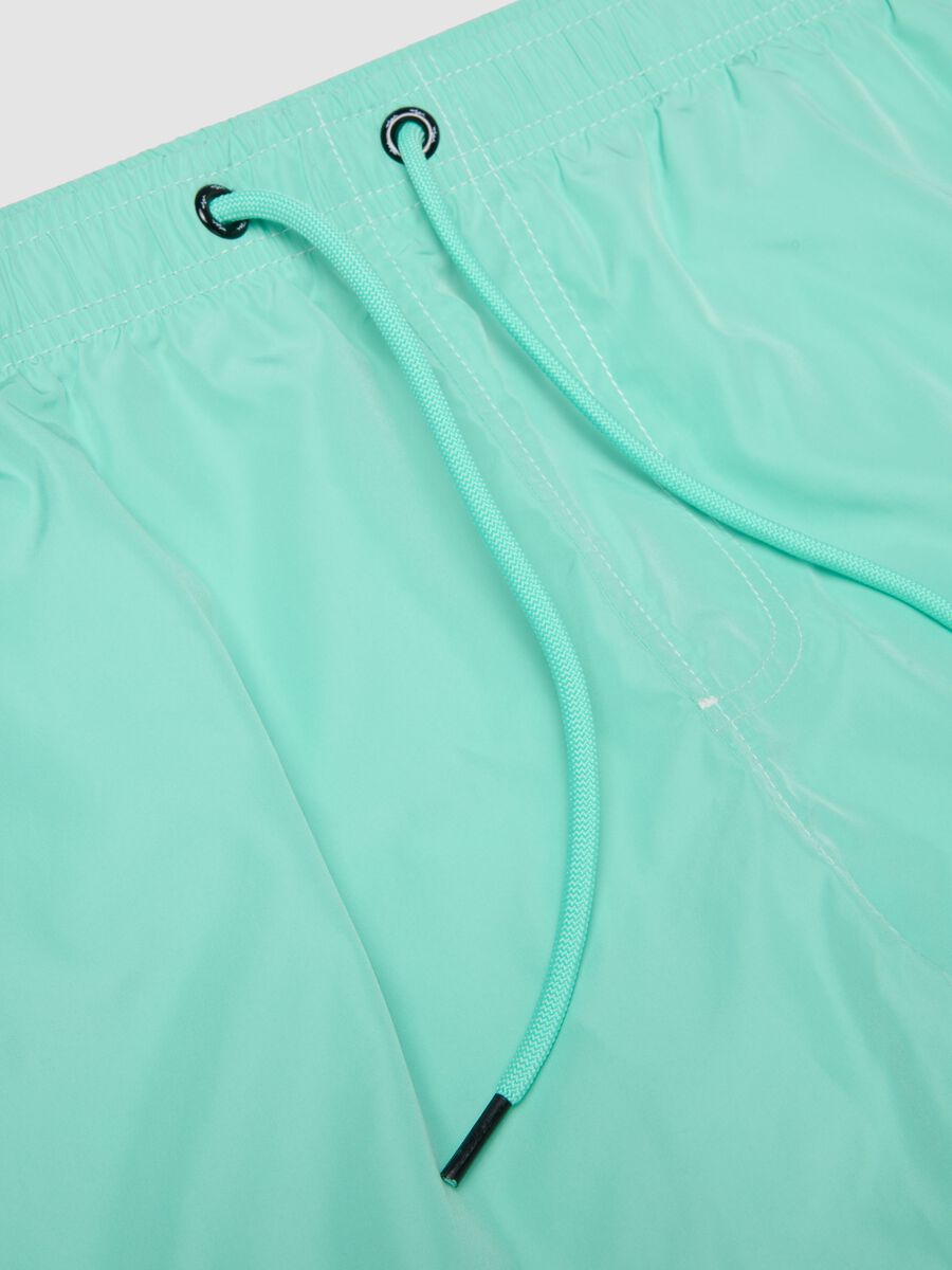 Light blue swim shorts with drawstring waist_5