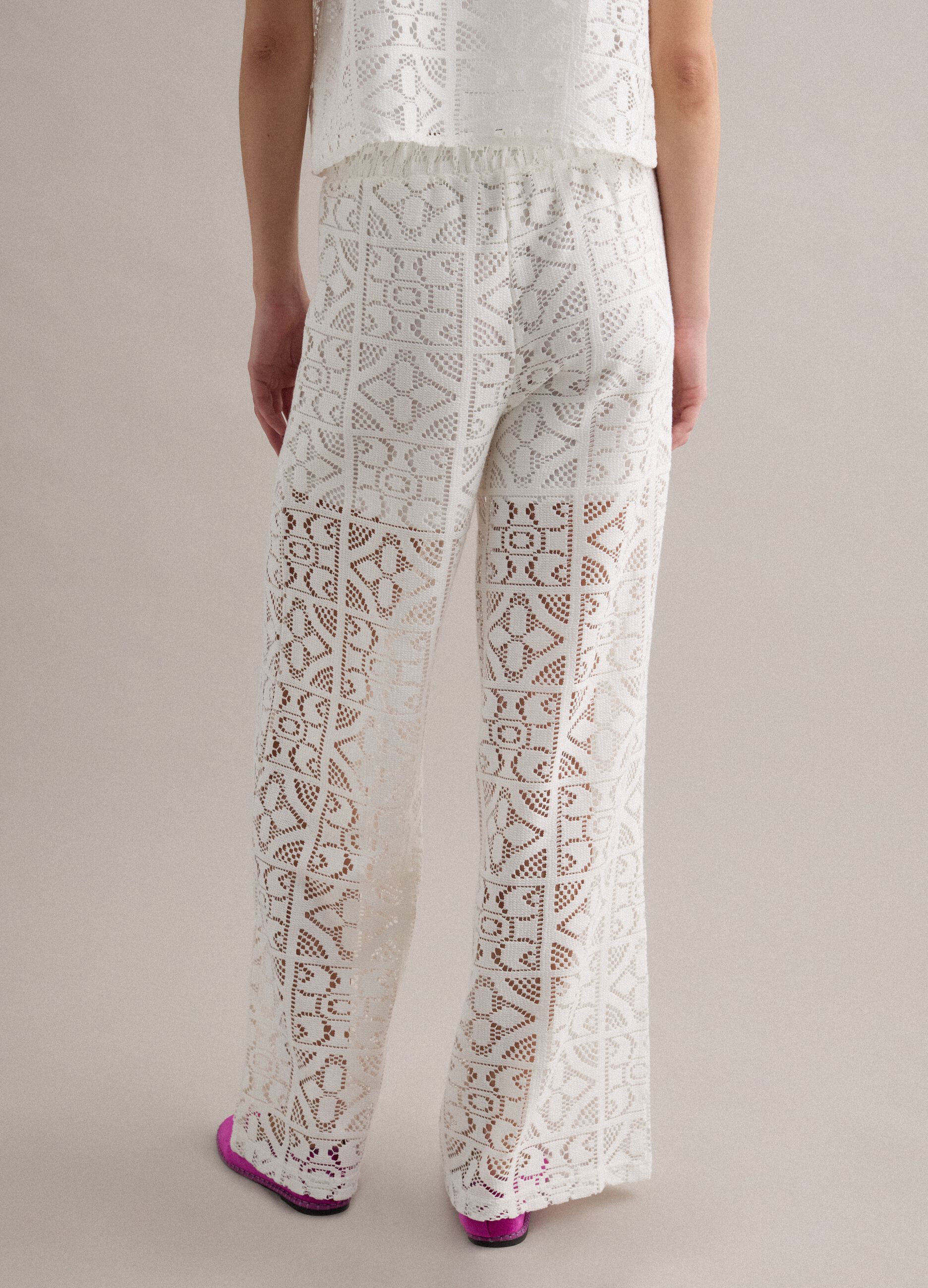 White openwork wide-leg trousers with elasticated waistband