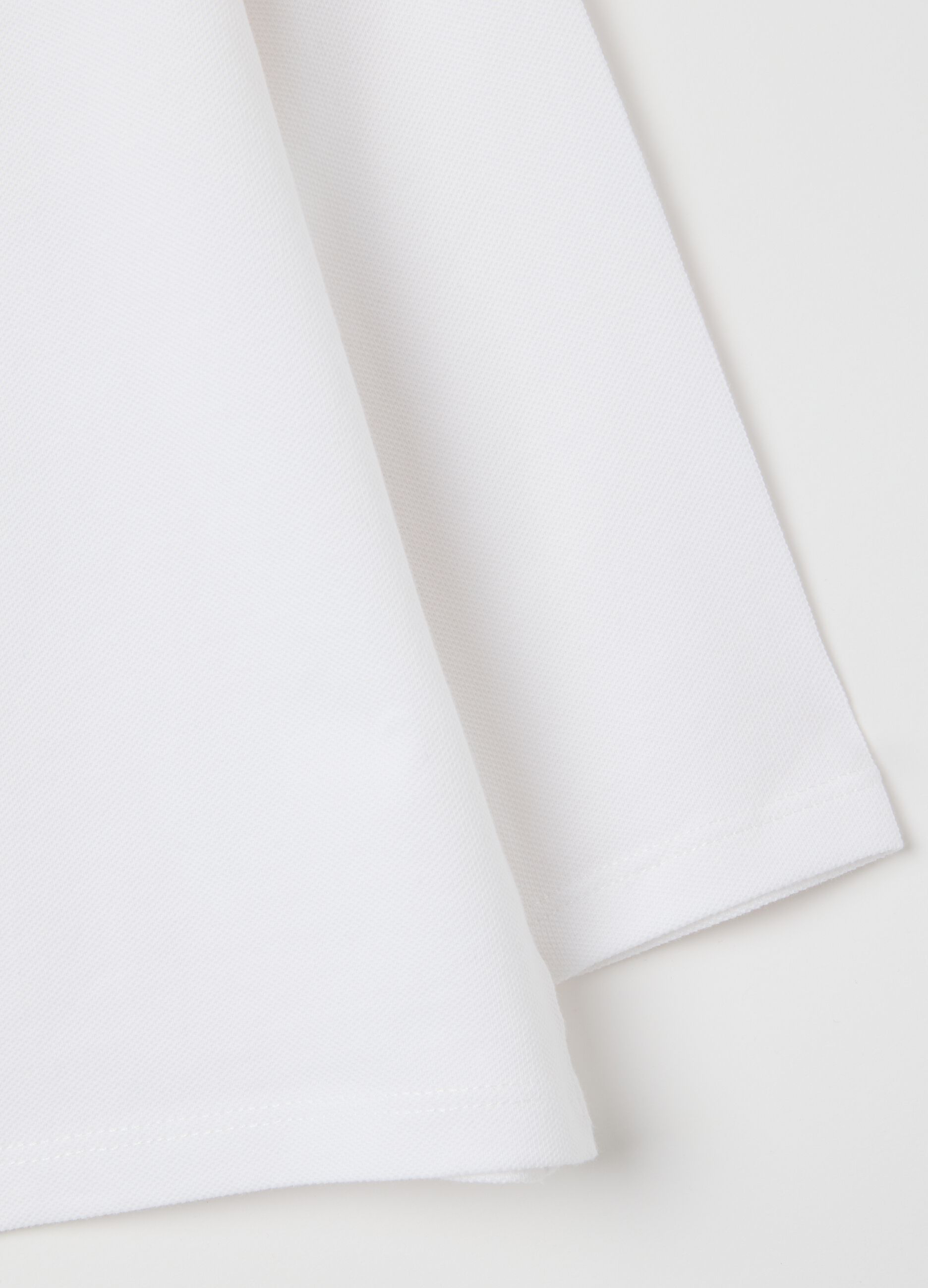 Baby polo shirt in pure white cotton regular fit
