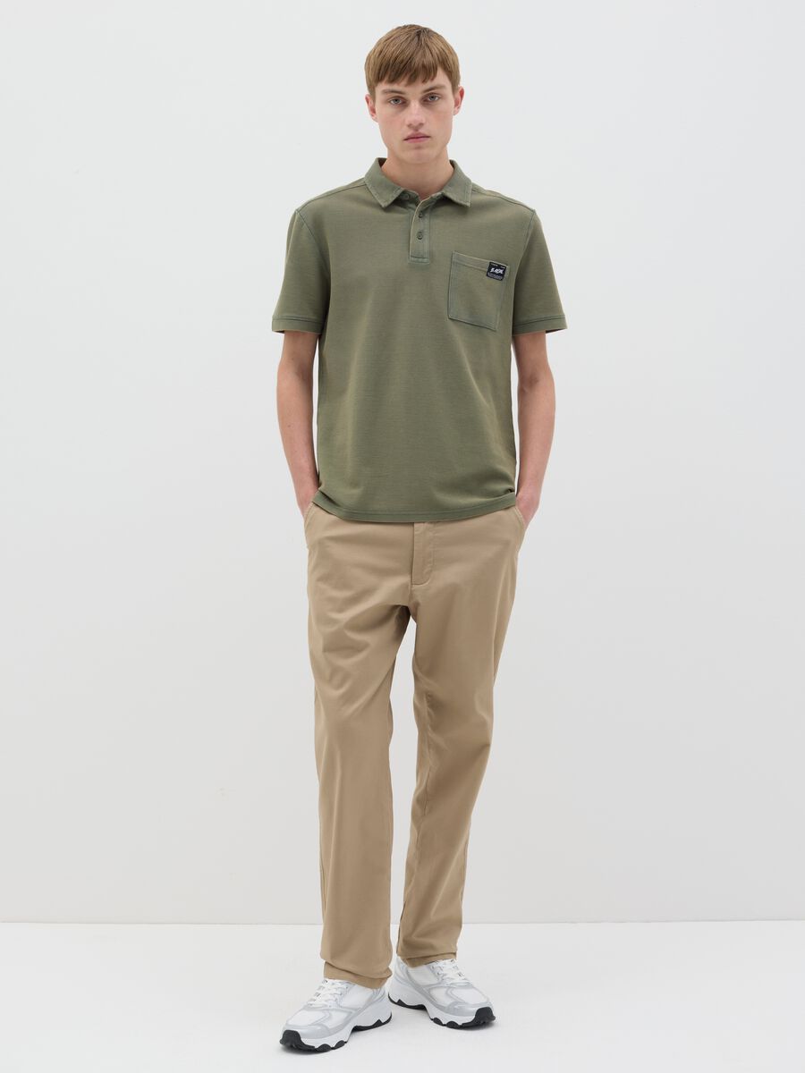 Green short-sleeved polo shirt in cotton piquet_1