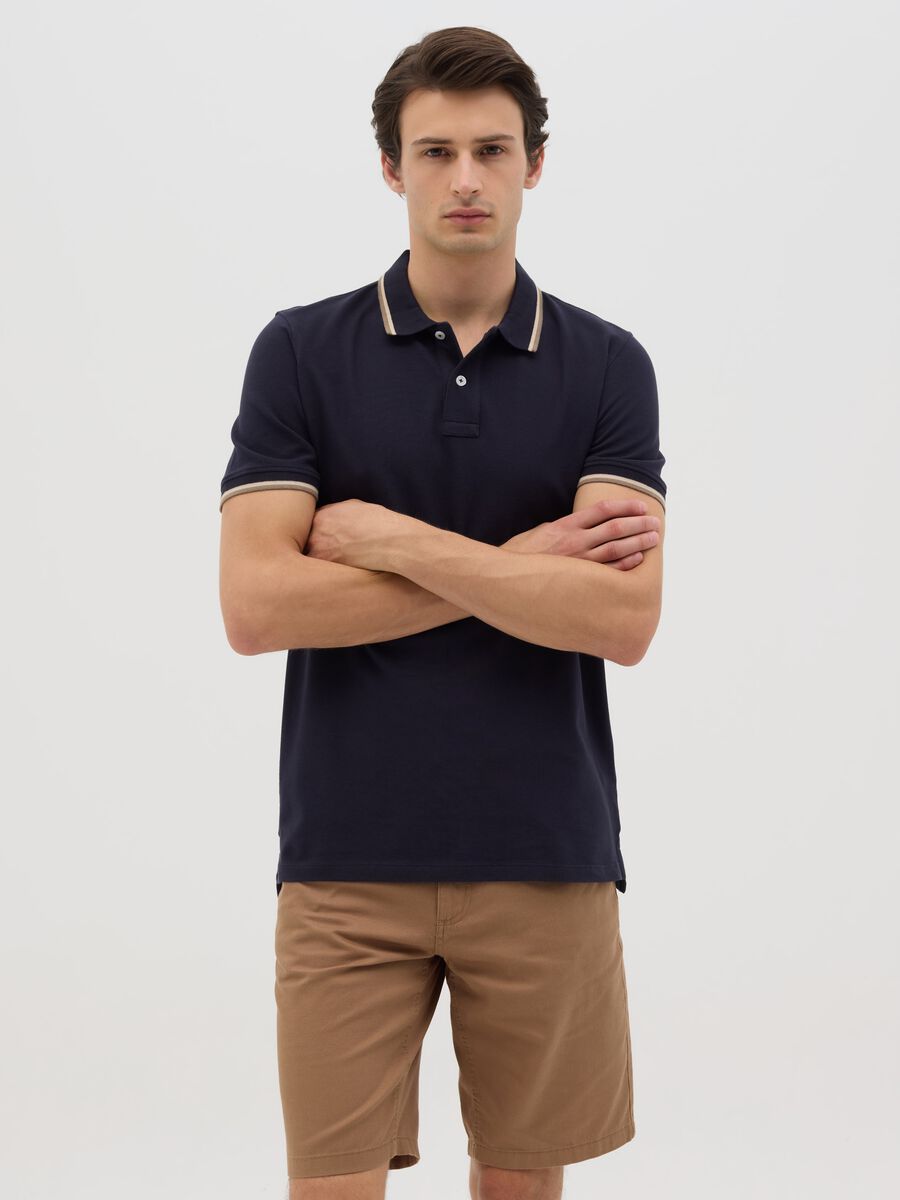 Blue short sleeve polo shirt in pure cotton_0
