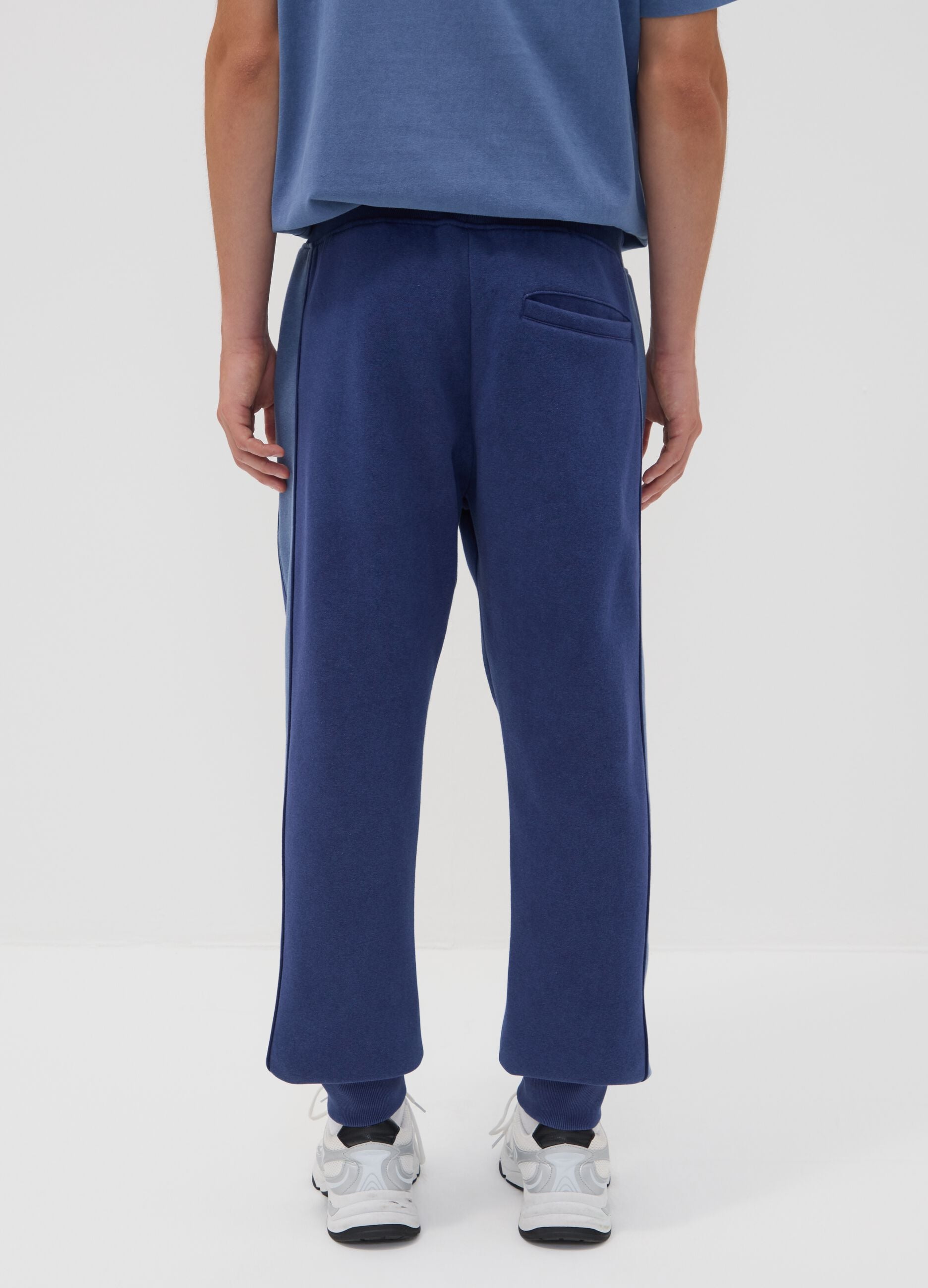 Blue cotton-blend joggers with print