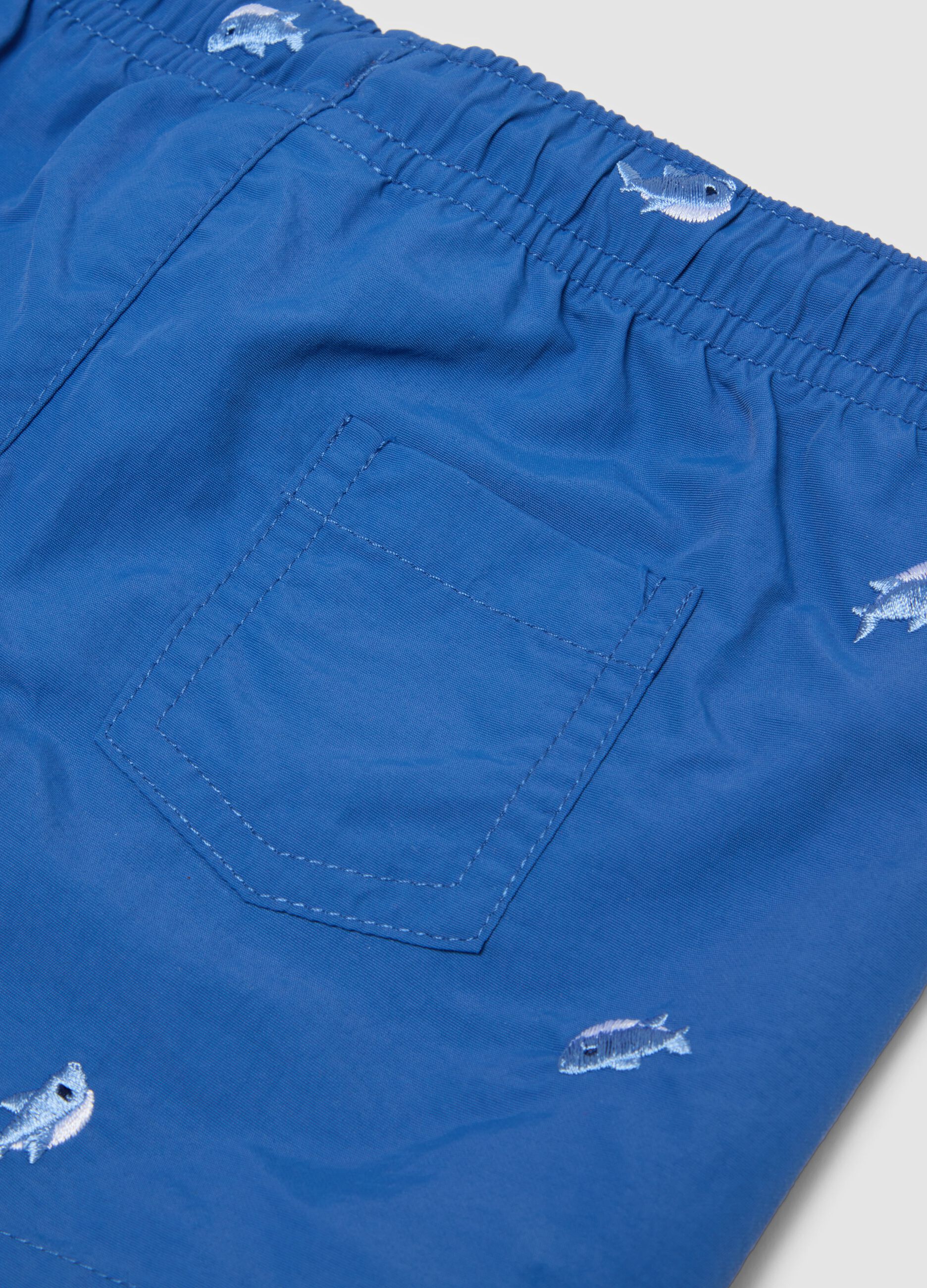 Sea-blue boys&rsquo; boxer swim shorts with fish print