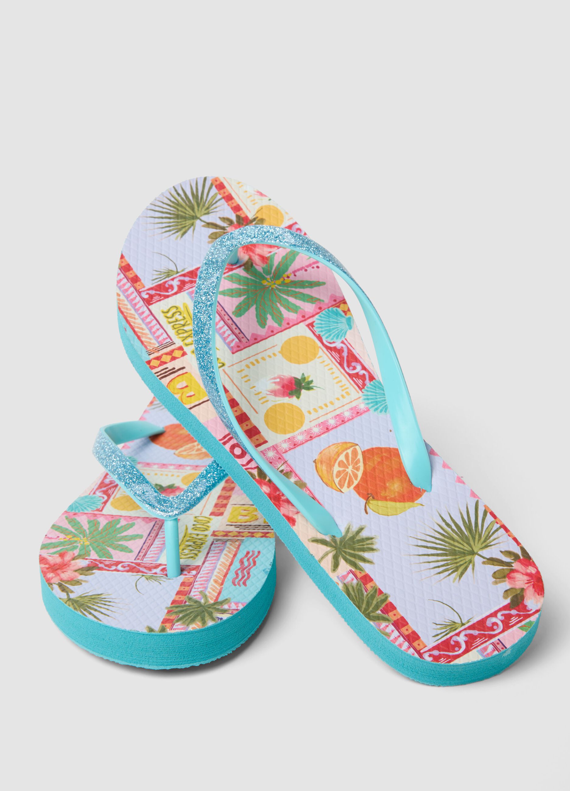Blue multicolour tropical print flip-flops