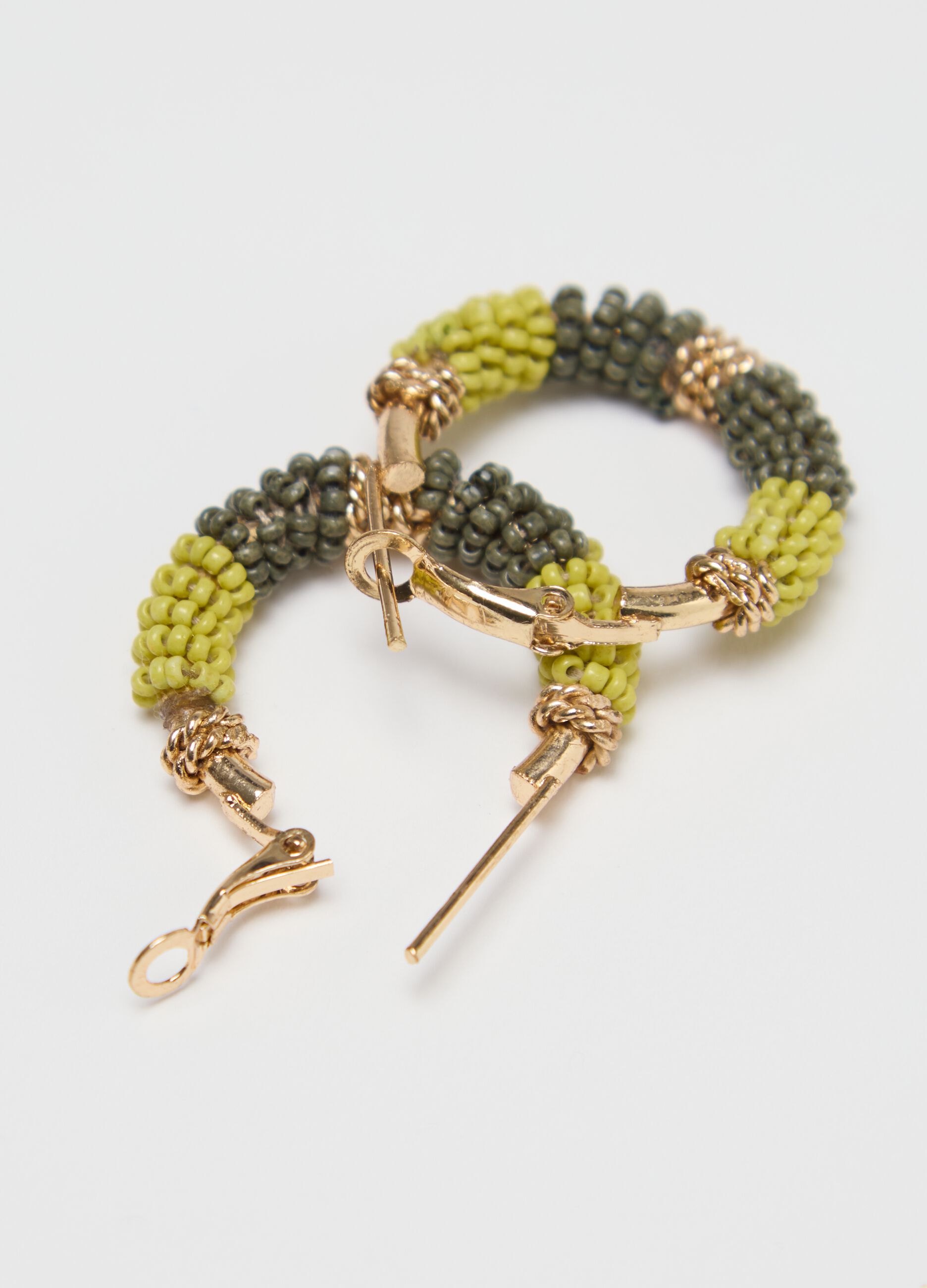 Hoop earrings with green and yellow beads