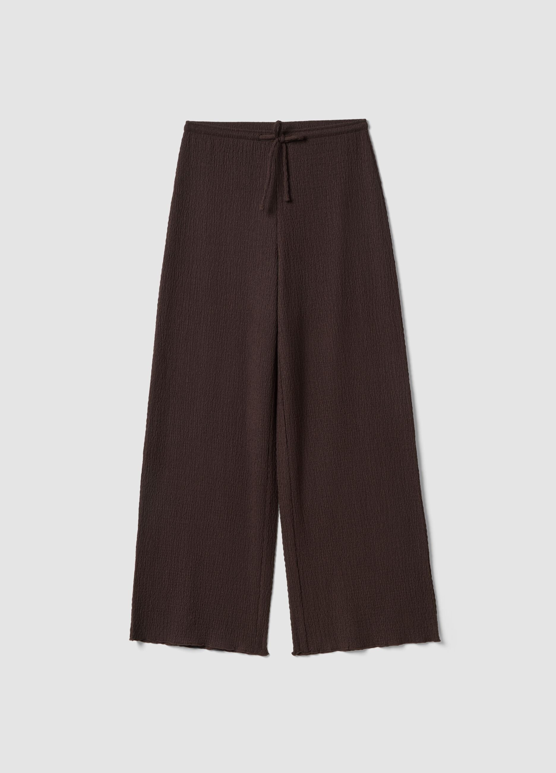 Brown stretch wide-leg trousers with crinkled texture