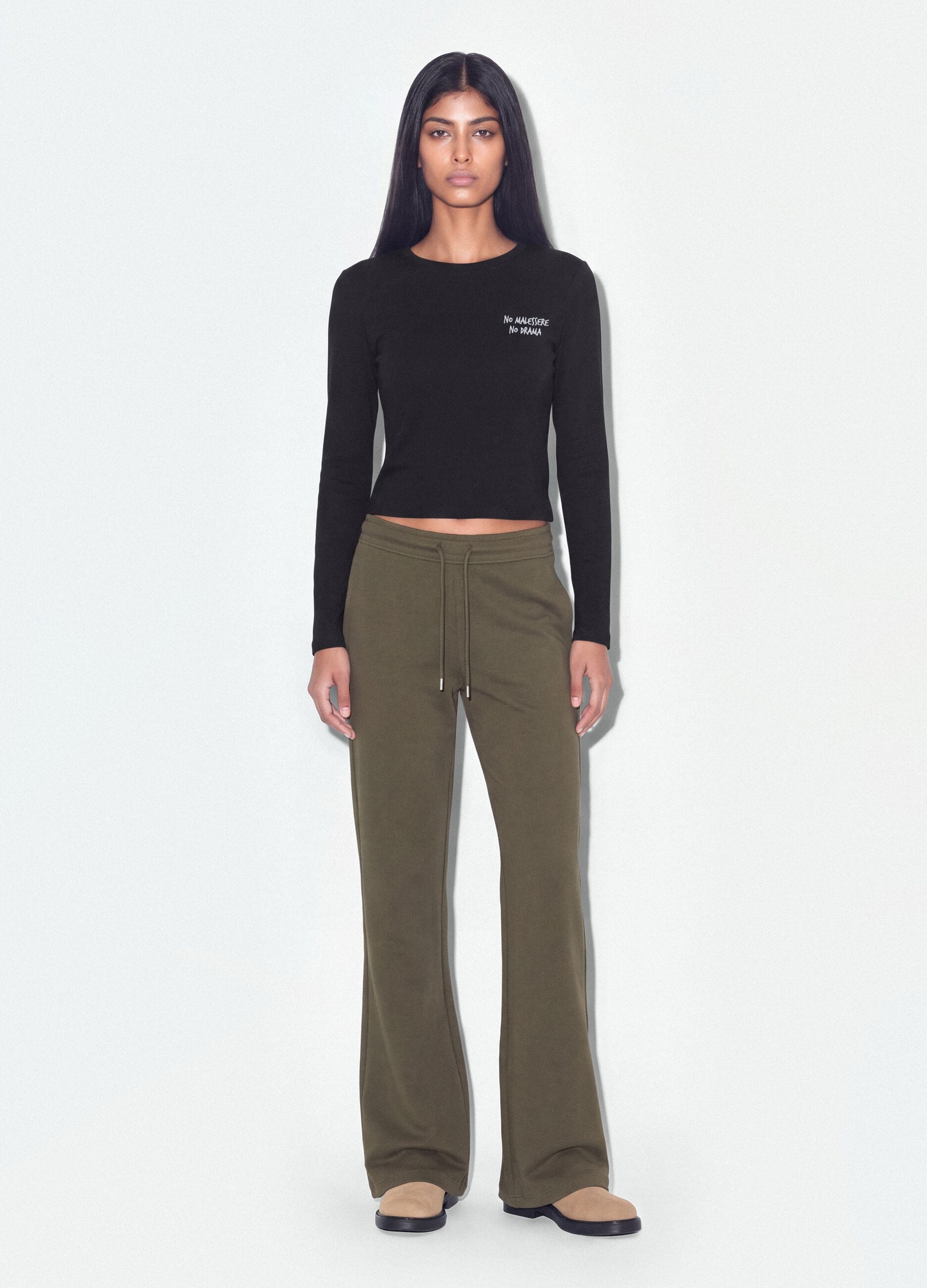 Jogger verde flare in cotone organico elasticizzato