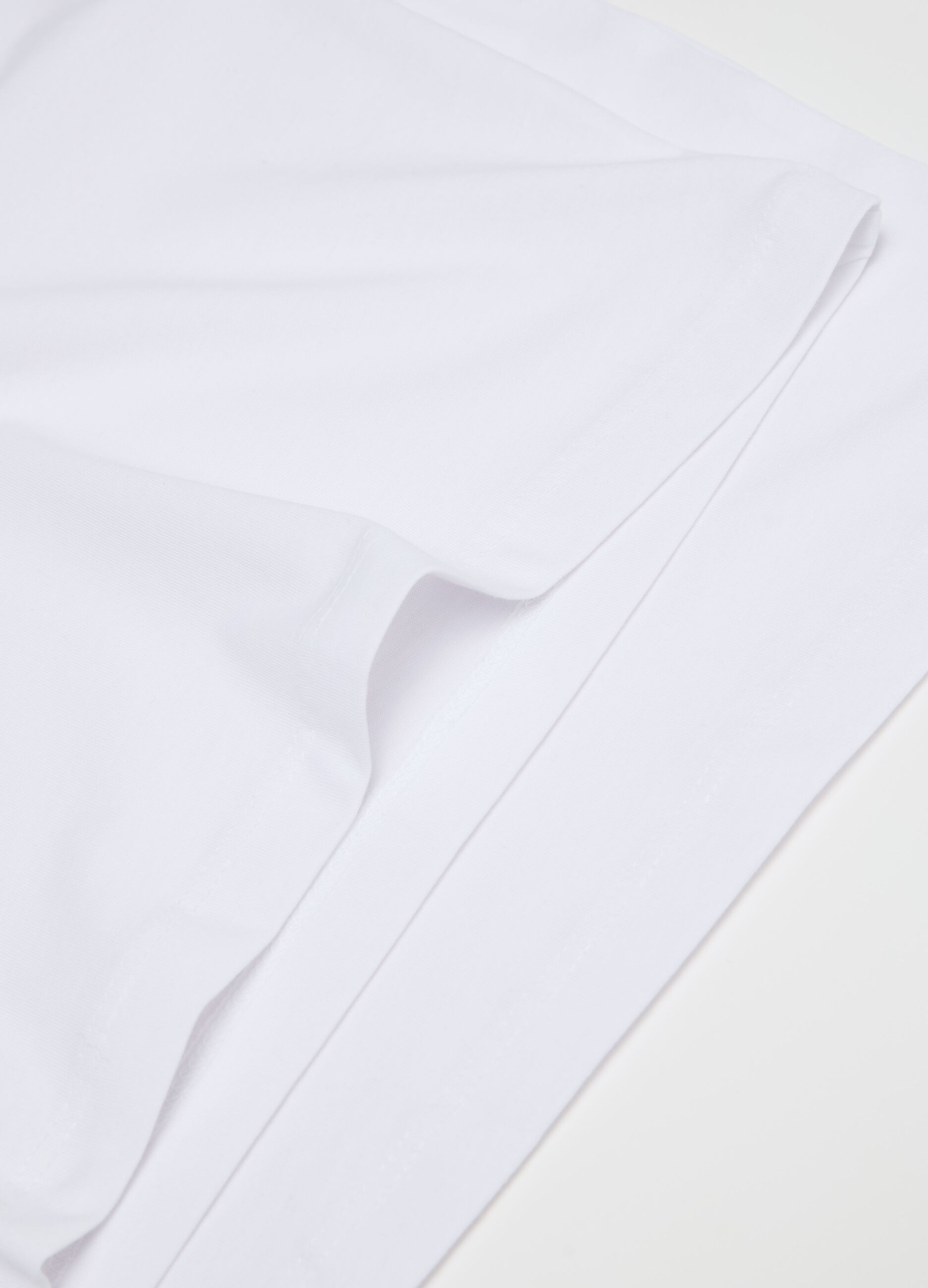 Three-pack racerback vests in organic cotton