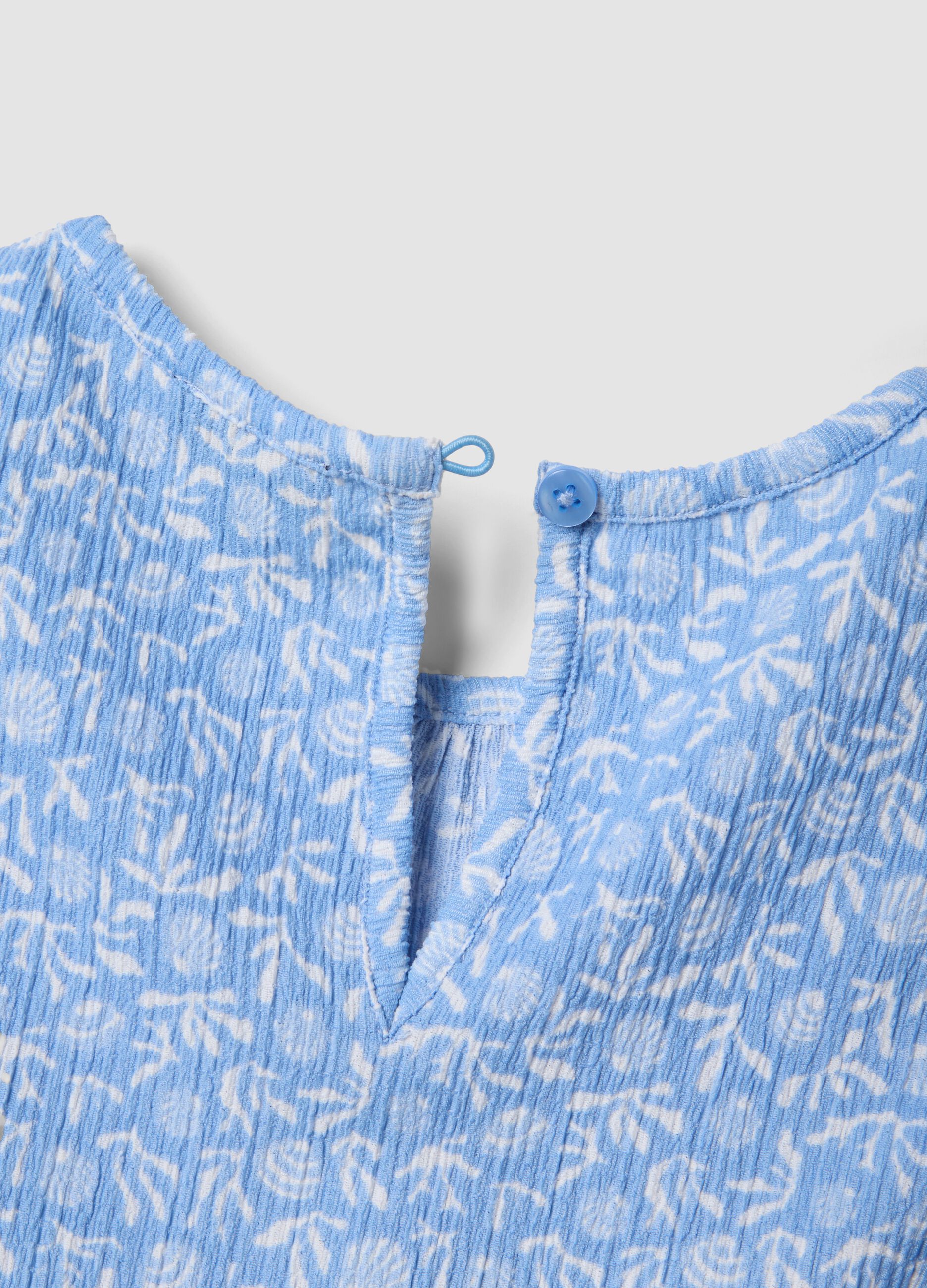 Blue stretch fabric set with sleeveless top and shorts