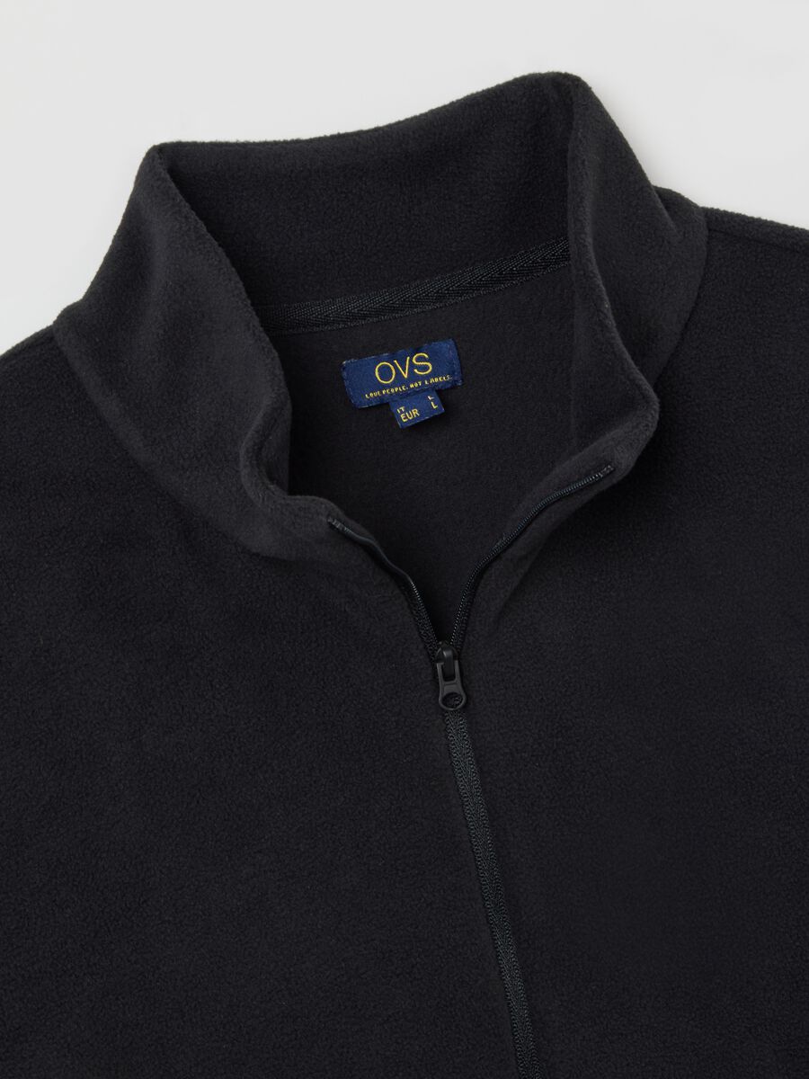 Felpa nera in pile con mezza zip_1