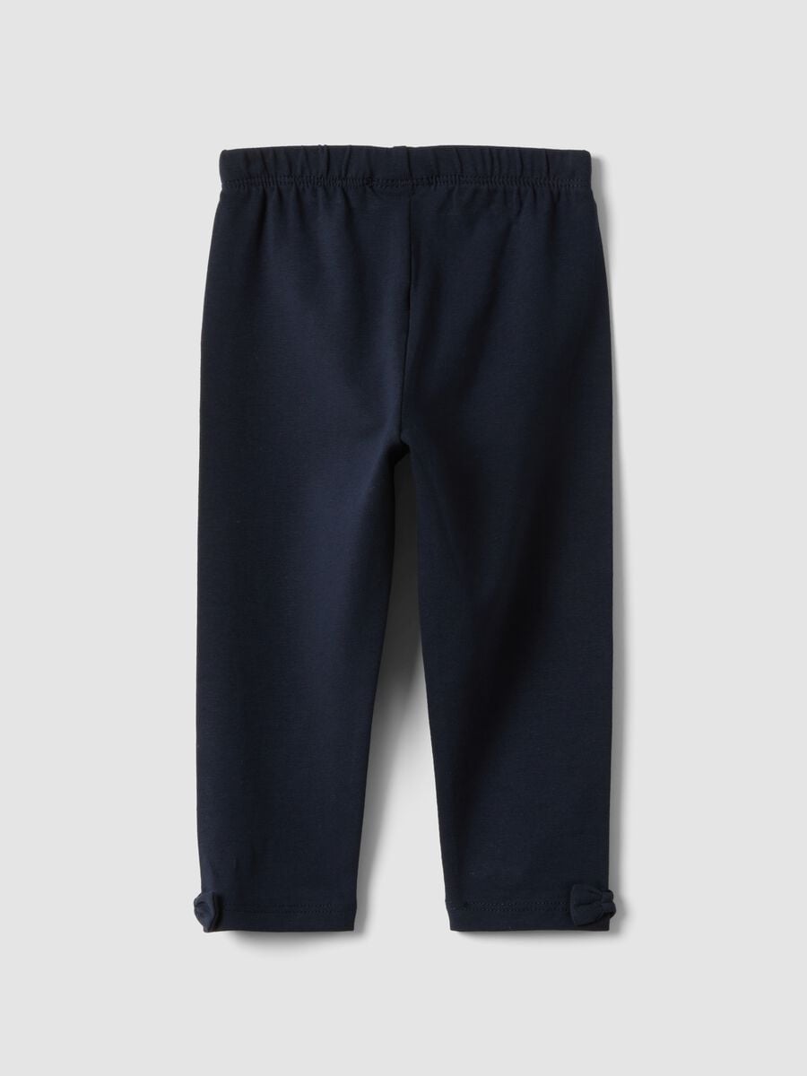 Leggings blu in cotone organico elasticizzato con fiocchi per bimba_1
