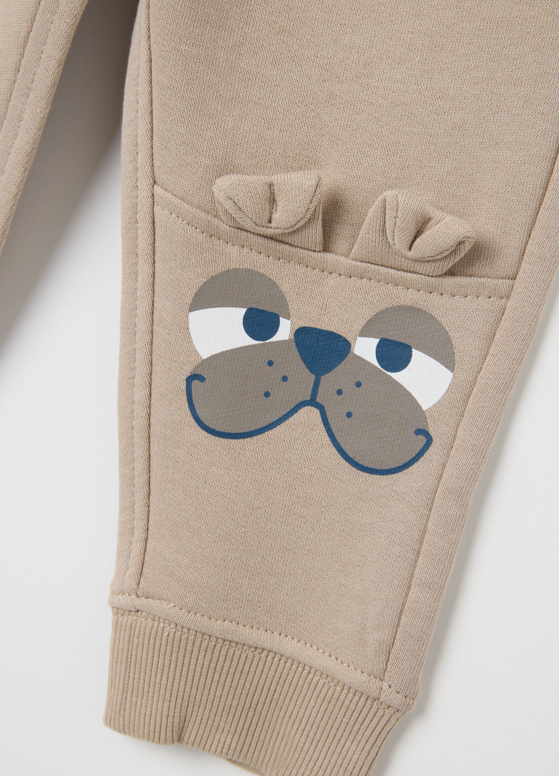 Baby trousers in pure beige cotton with dog print