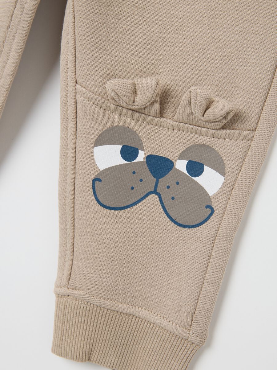 Baby trousers in pure beige cotton with dog print_3