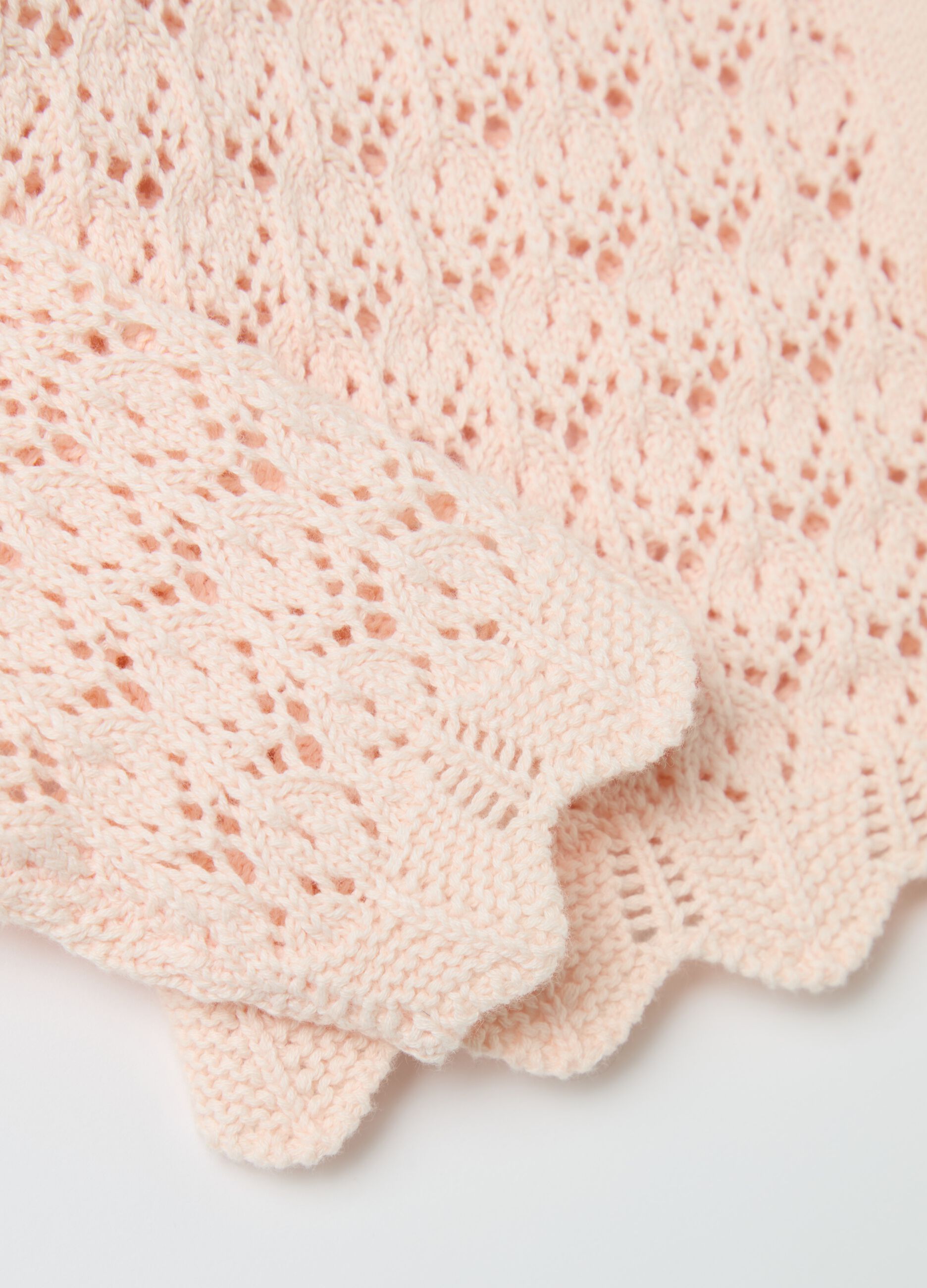 Cardigan with openwork weave and crochet flowers