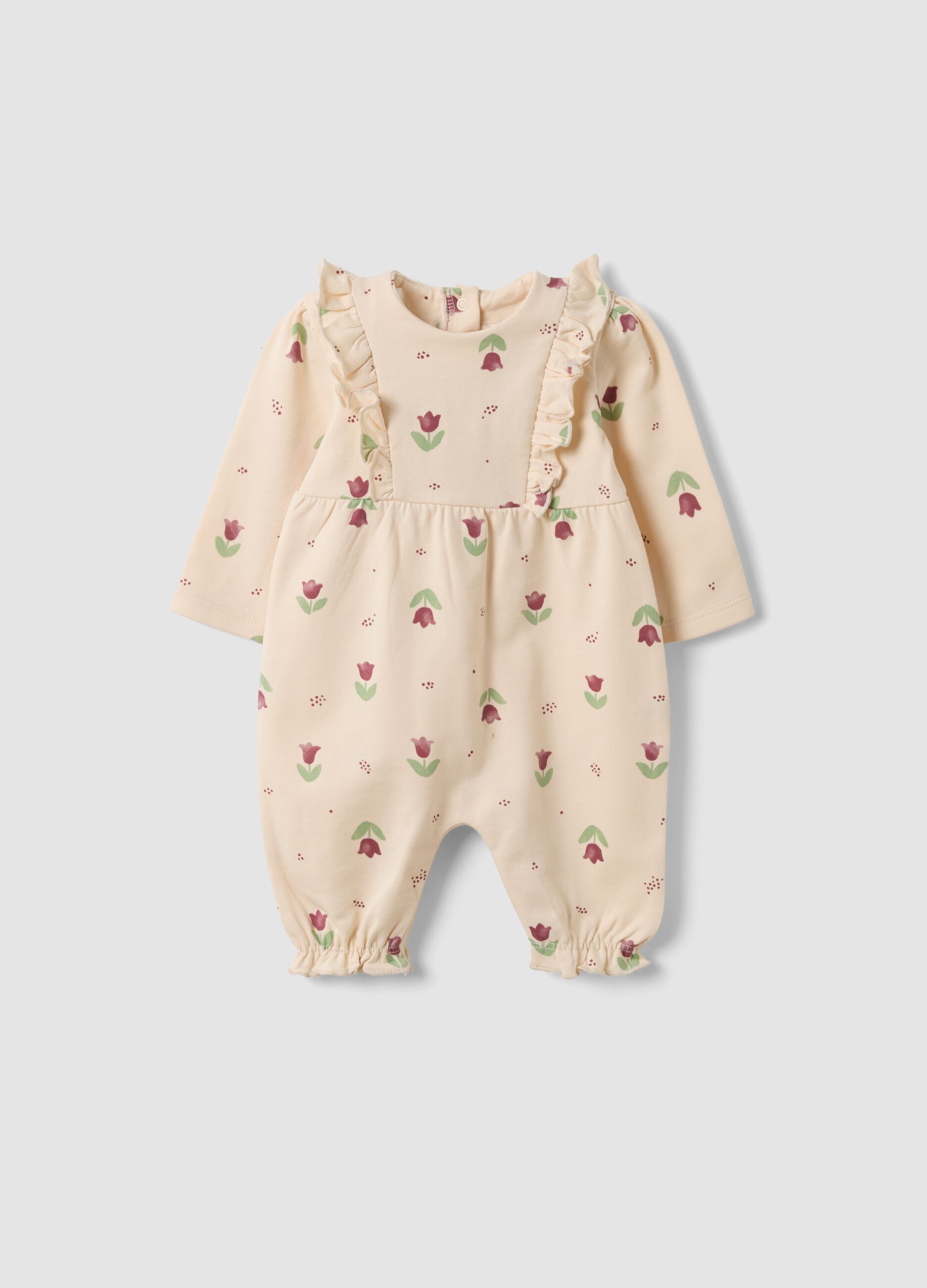 Tutina beige in puro cotone organico con stampa floreale per neonata