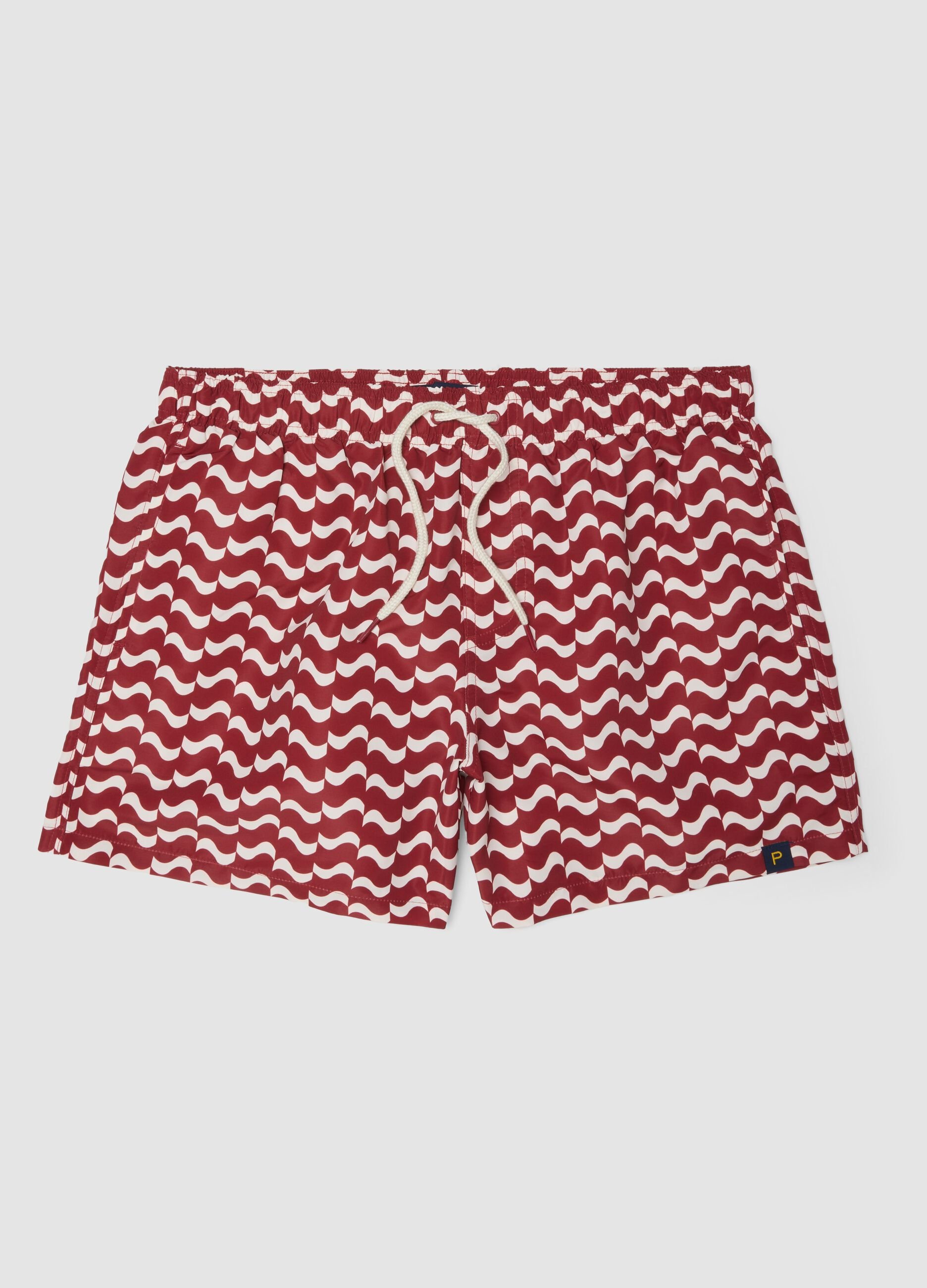 Red men&rsquo;s swim shorts with all-over print