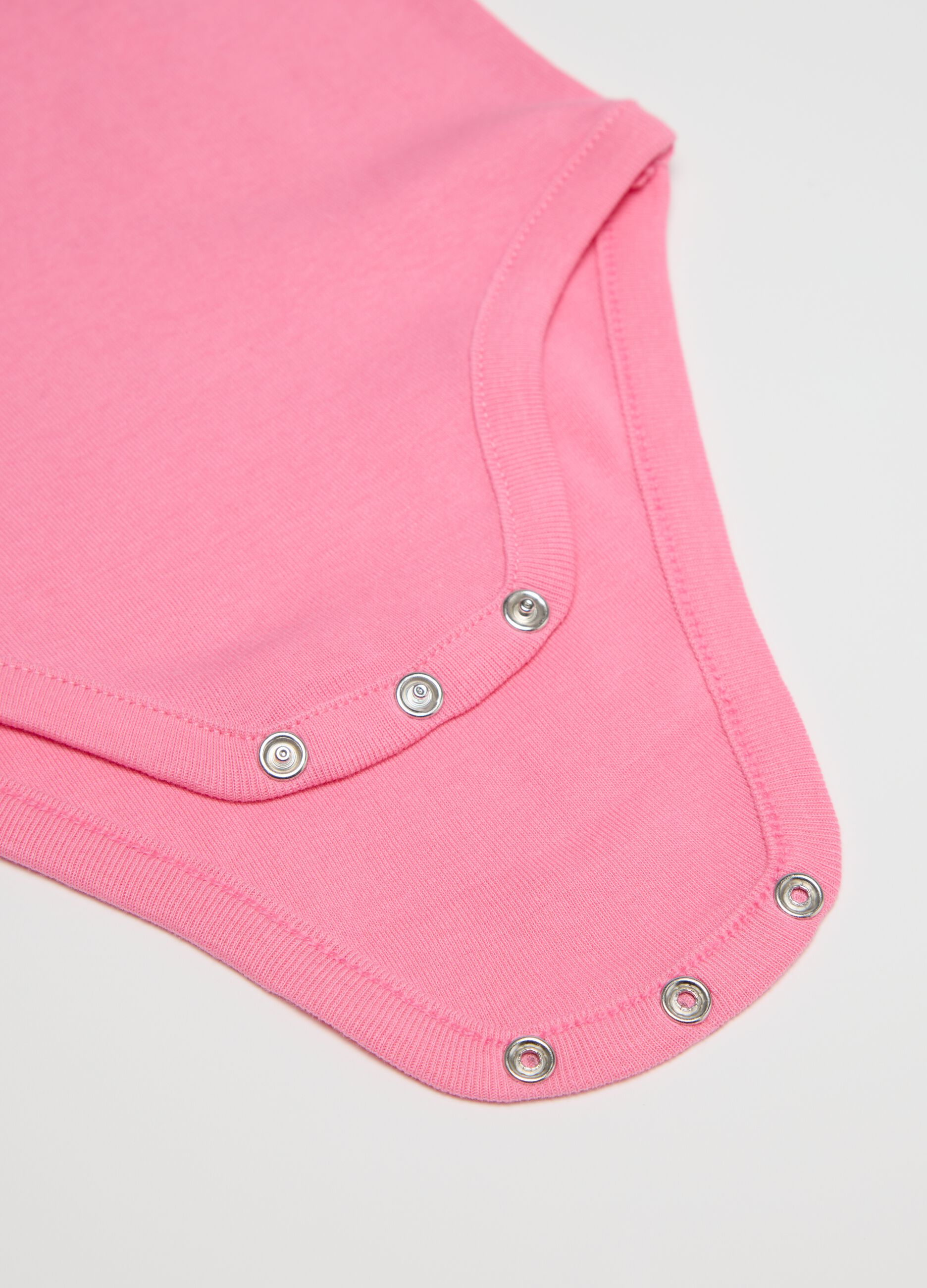 Three-pack white and pink bodysuits in organic cotton