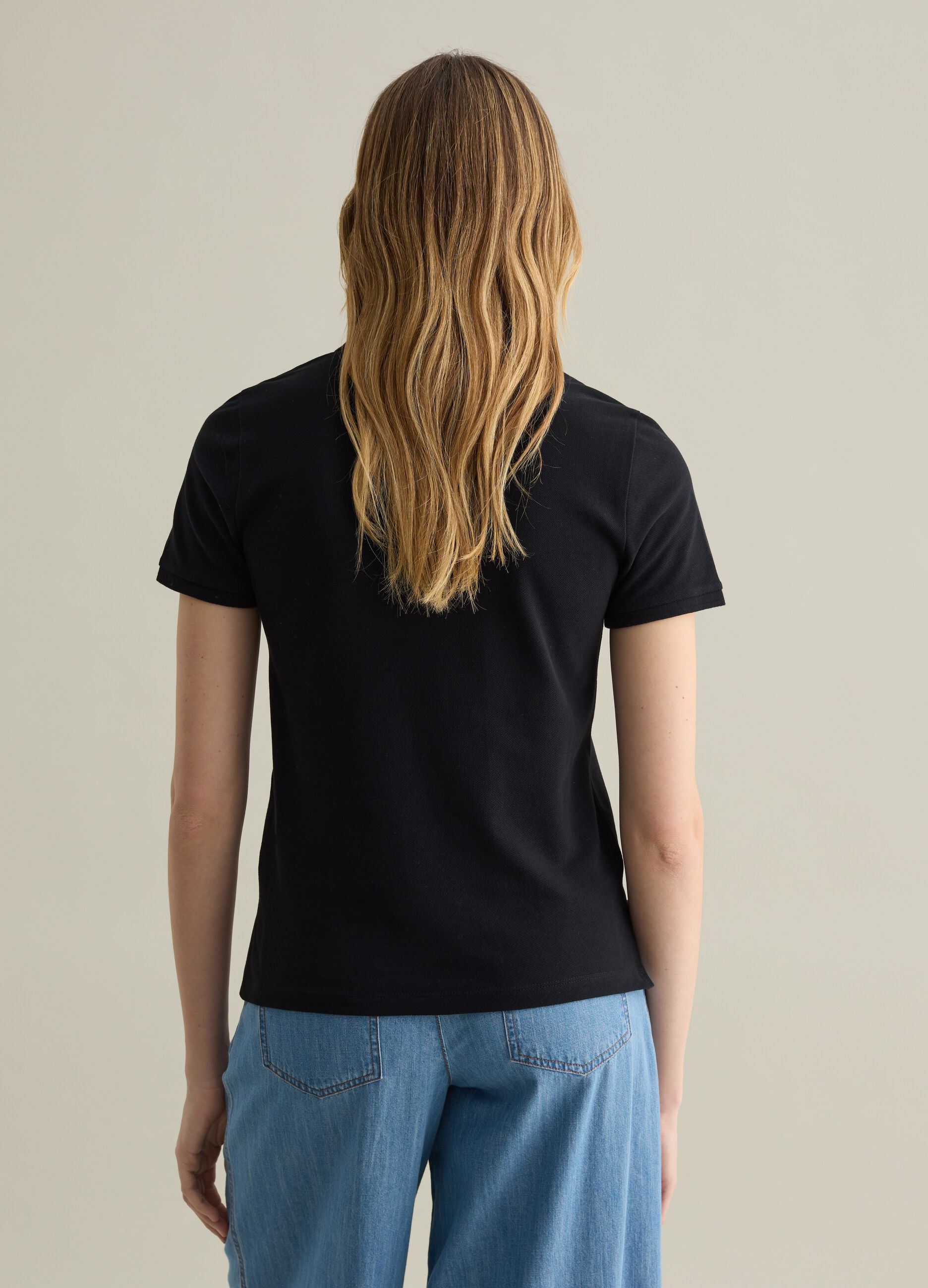 Black short-sleeved polo shirt in piquet