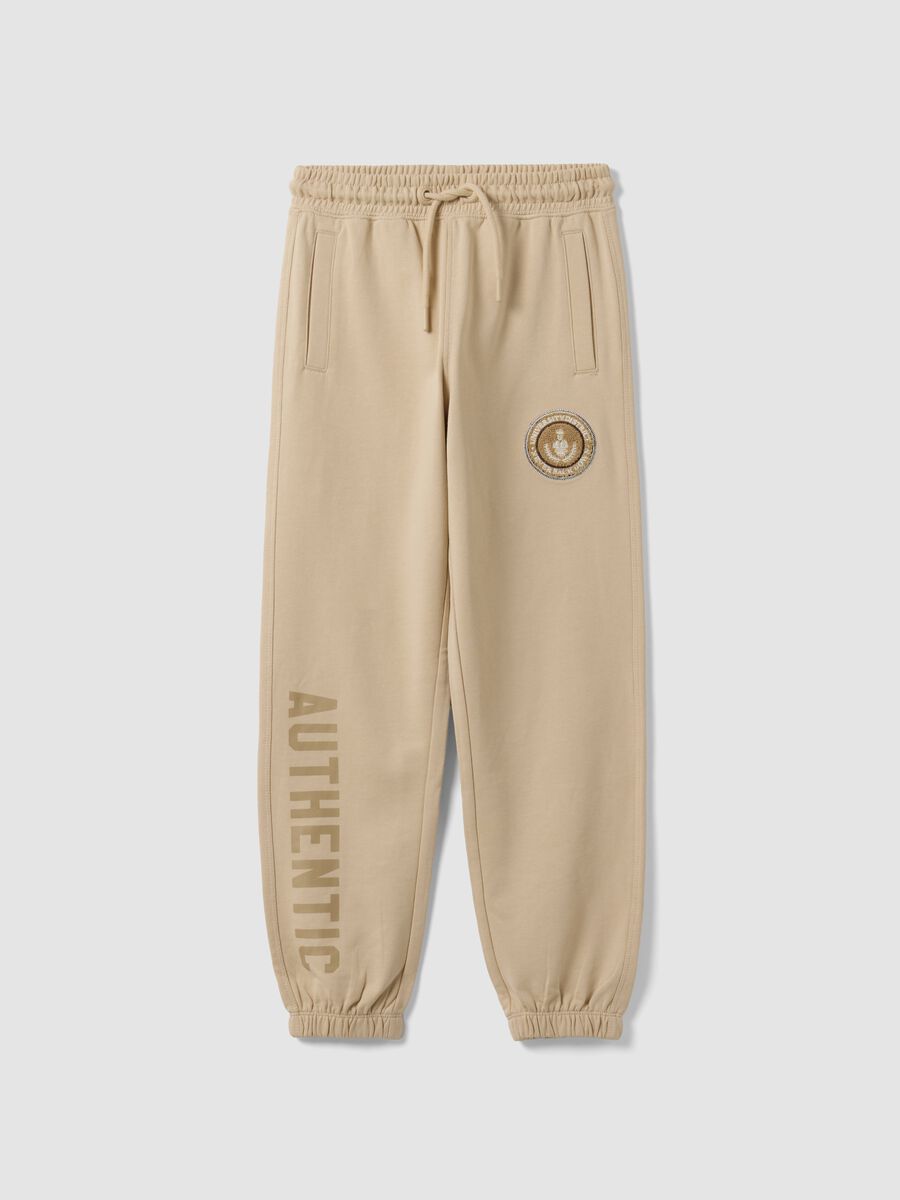 Jogger beige in puro cotone con stampa comfort fit per ragazzo_0
